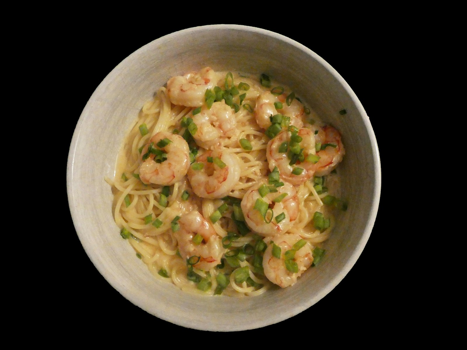 Creamy pasta with Cajun shrimp and parsley