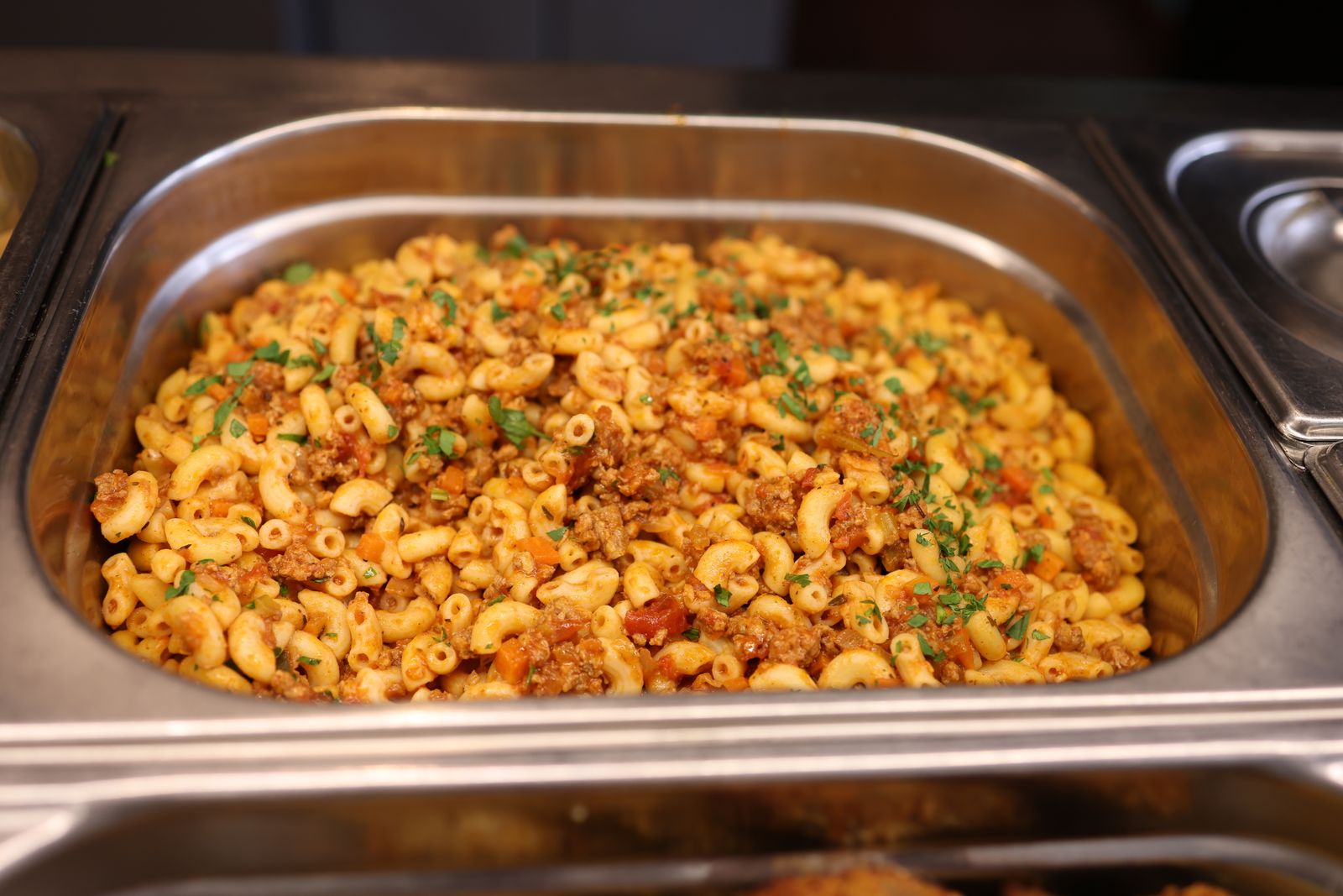 Chili pasta casserole with melted cheddar