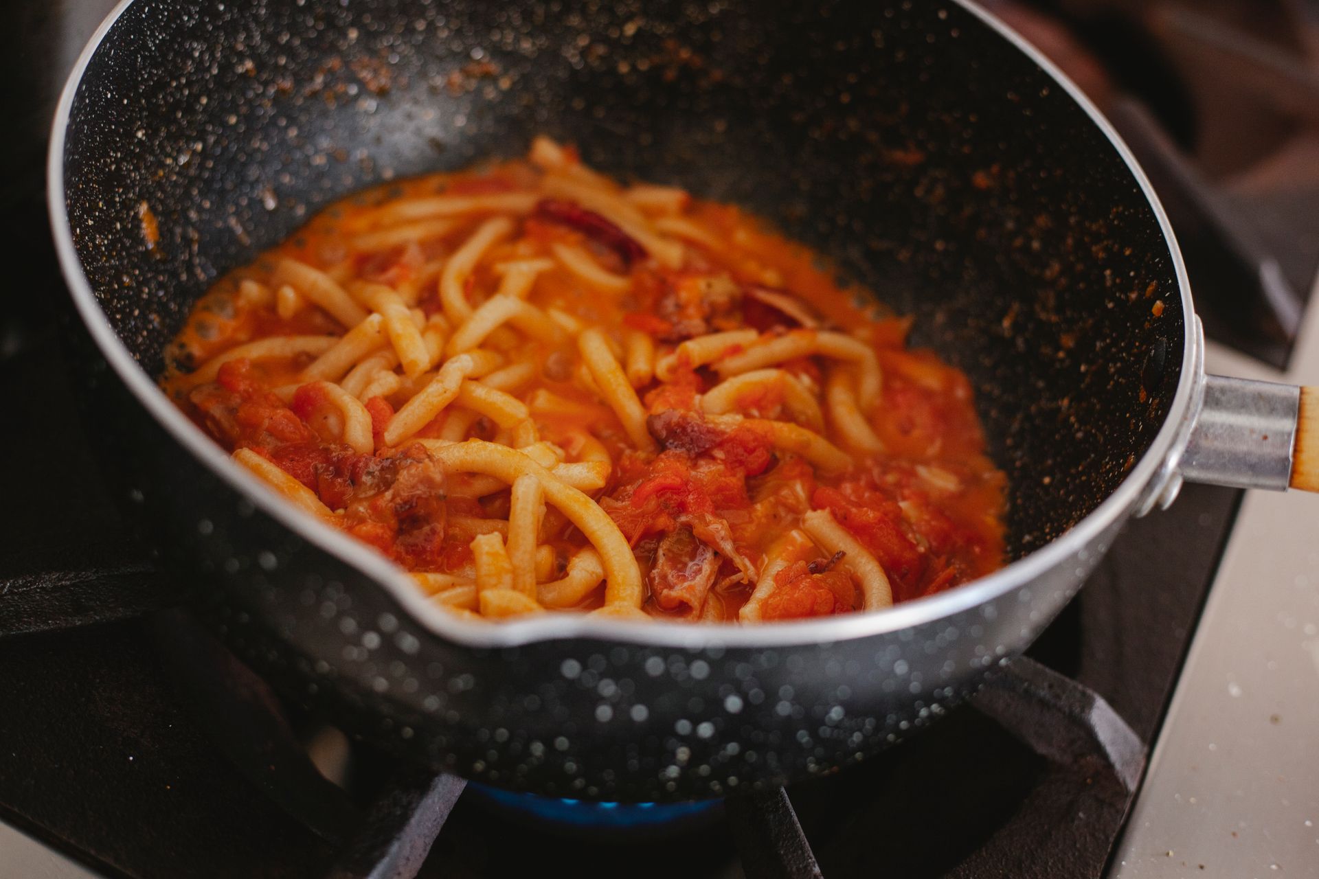 One-pot pasta: spaghetti cooked in a rich tomato meat sauce in a nonstick pot