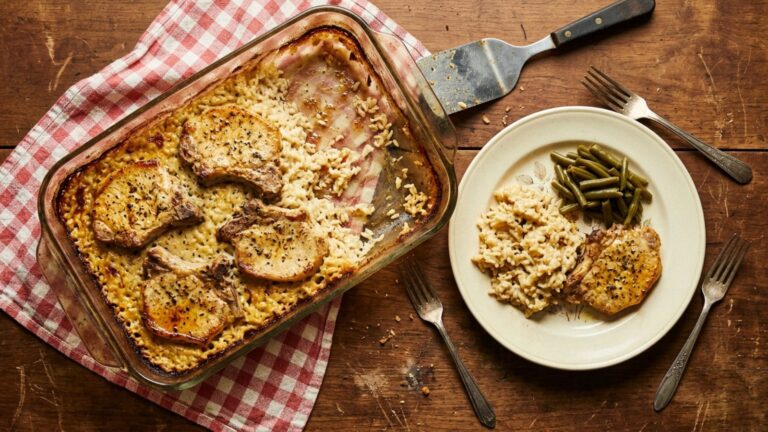 9x13 pan dinners: oven baked pork chops on creamy rice in a glass dish on a checked tablecloth