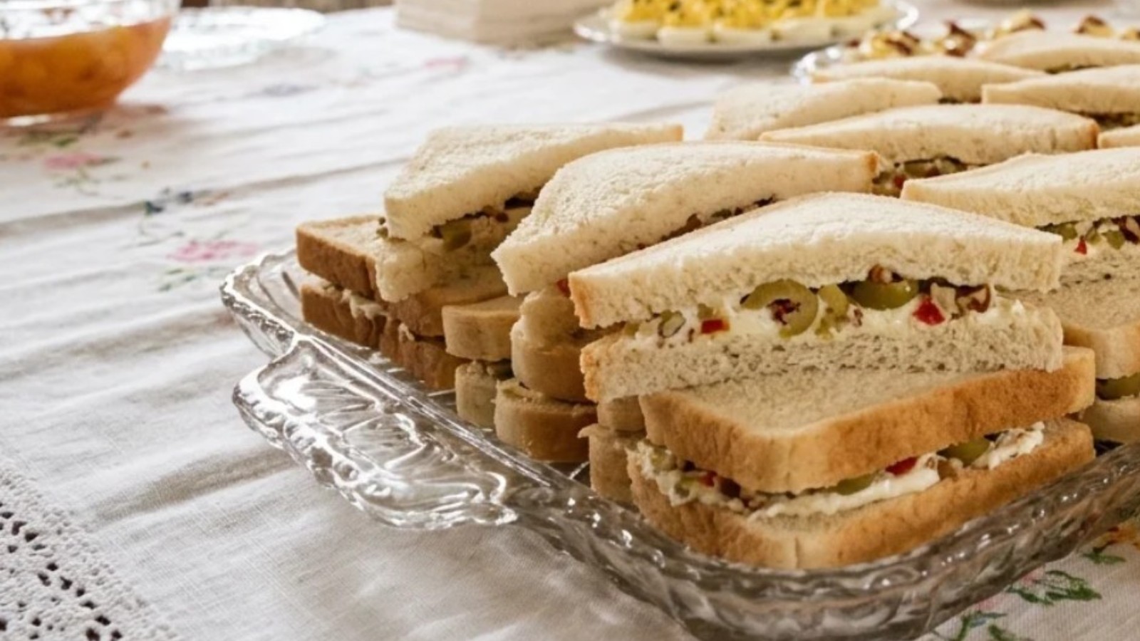 Cream cheese and green olive spread on bread, old fashioned sandwiches