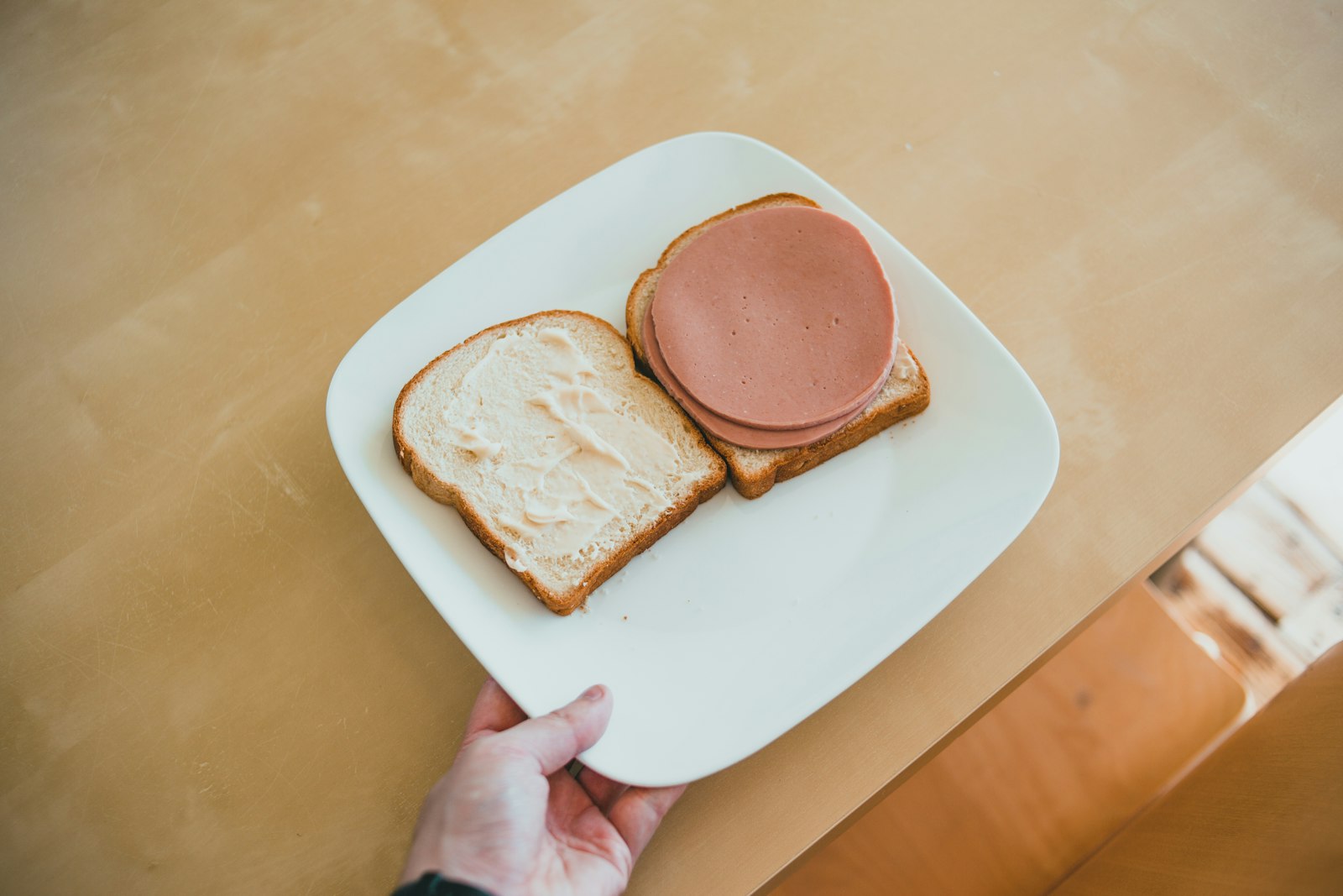 Fried bologna sandwich with browned curled edges