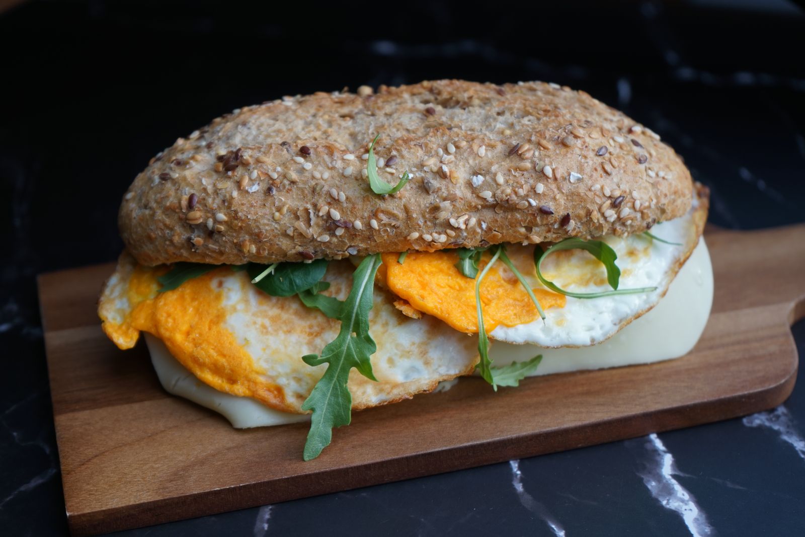Fried egg sandwich on toast with a runny yolk, old fashioned sandwiches