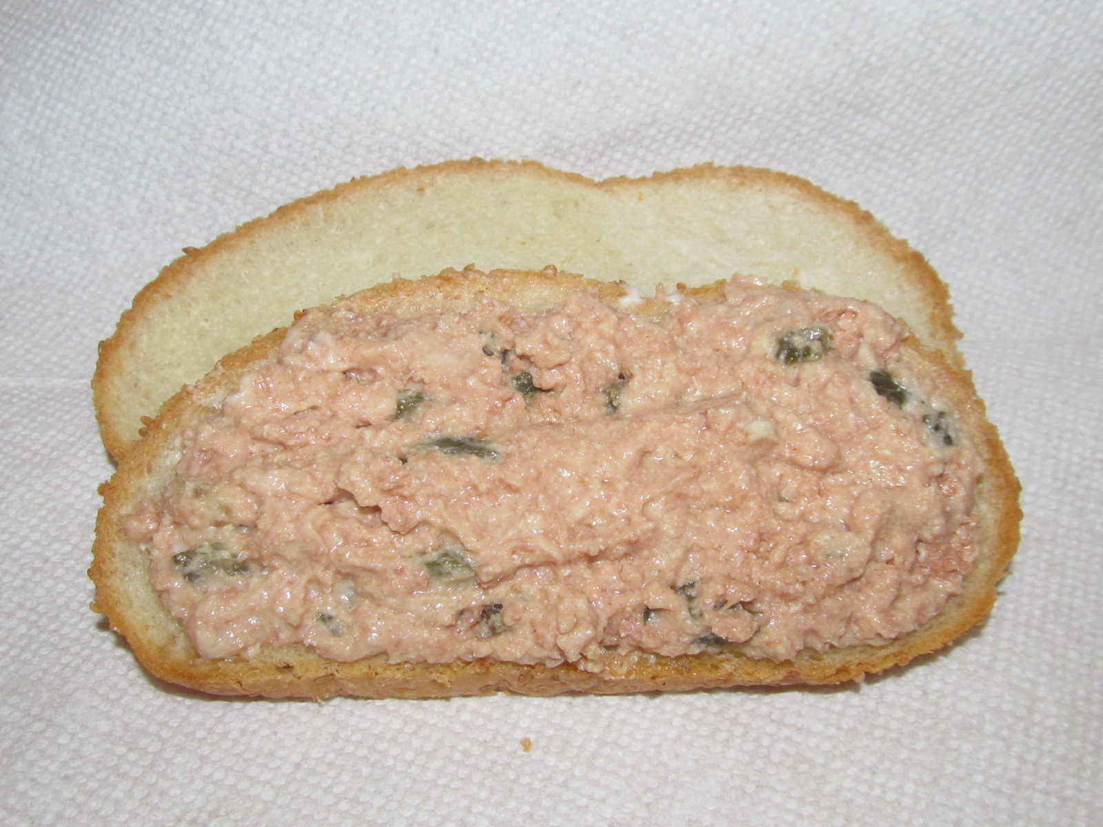 Ham salad sandwich spread on bread