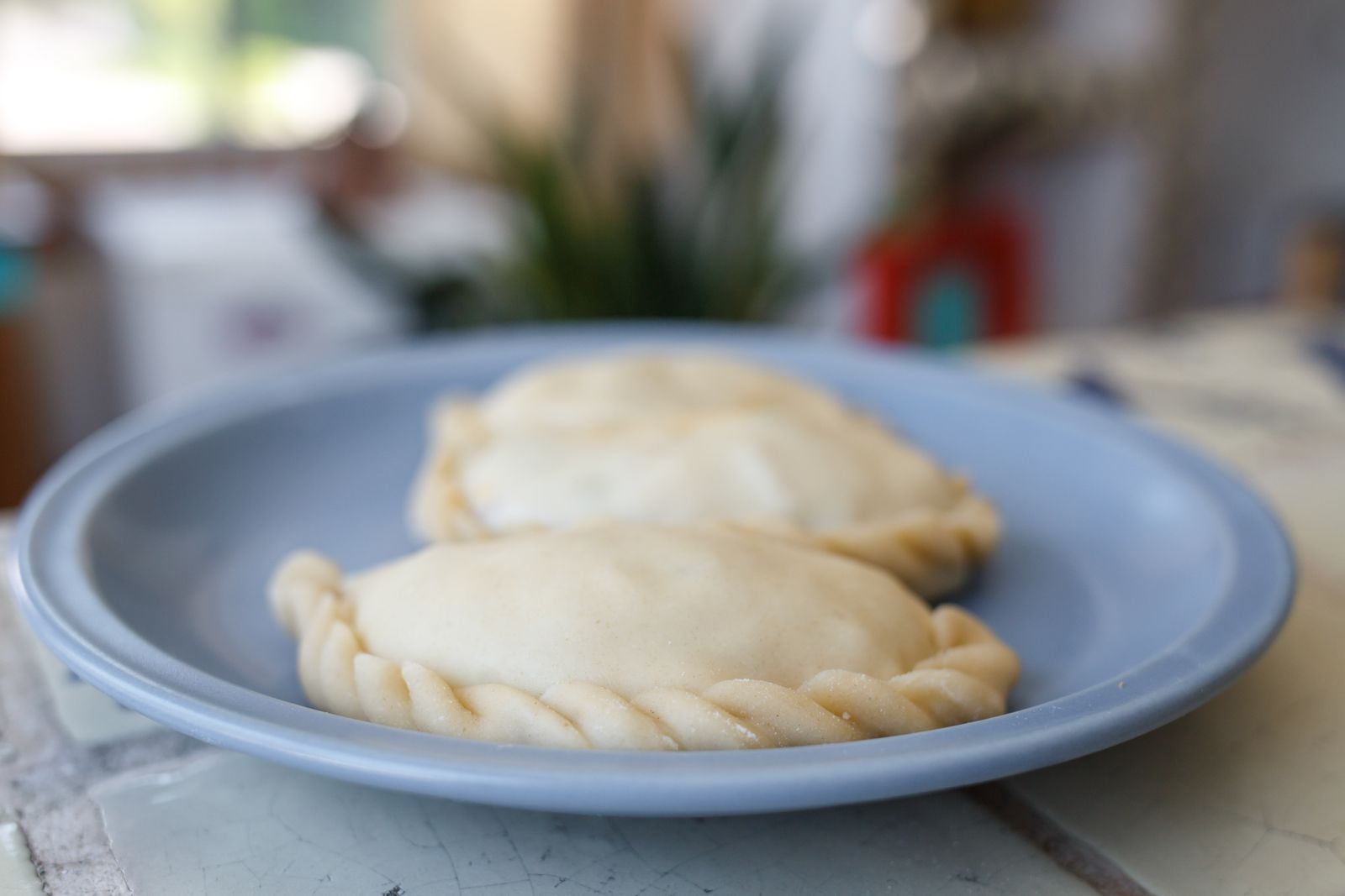 Golden stuffed pockets on a blue plate