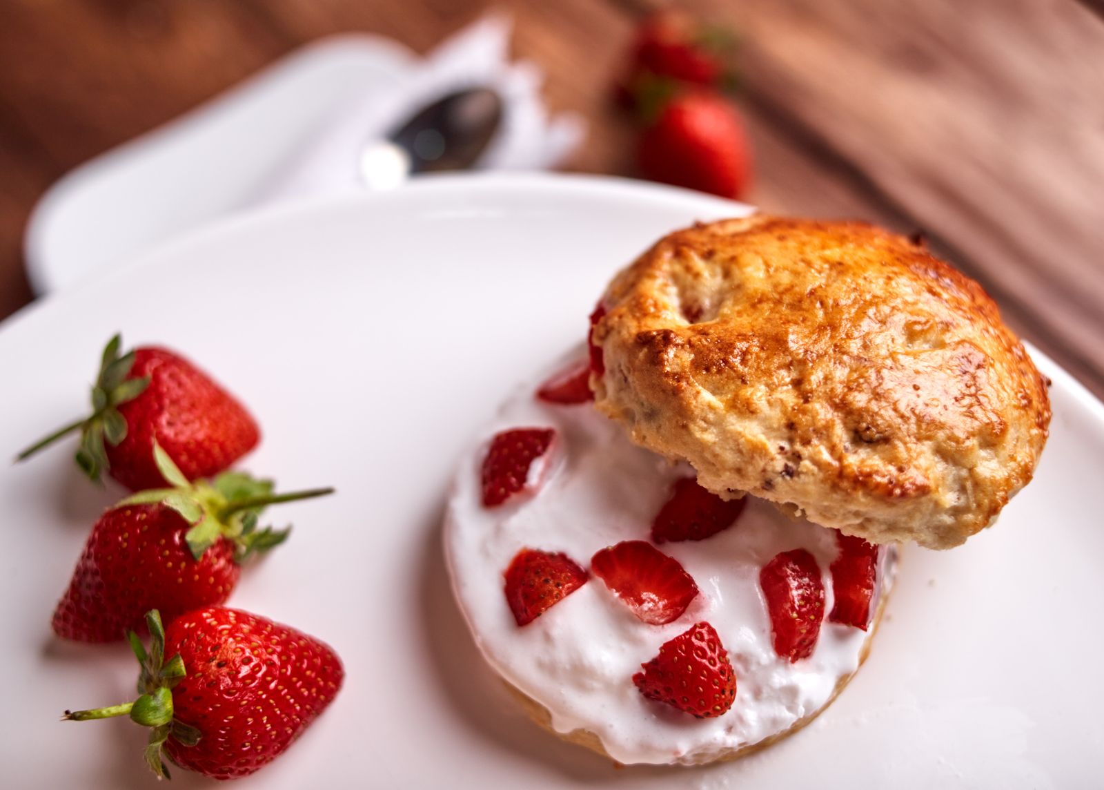 Strawberry shortcake on a split biscuit with cream