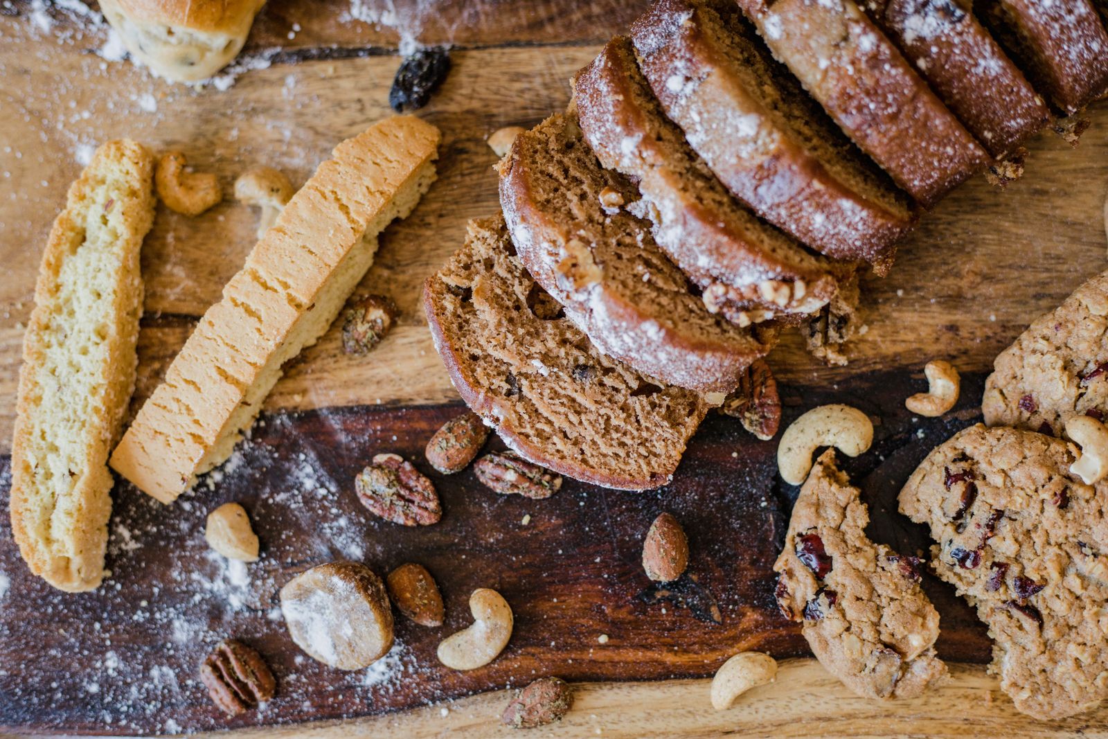 Biscotti: classic almond biscotti slices on a wooden board with nuts