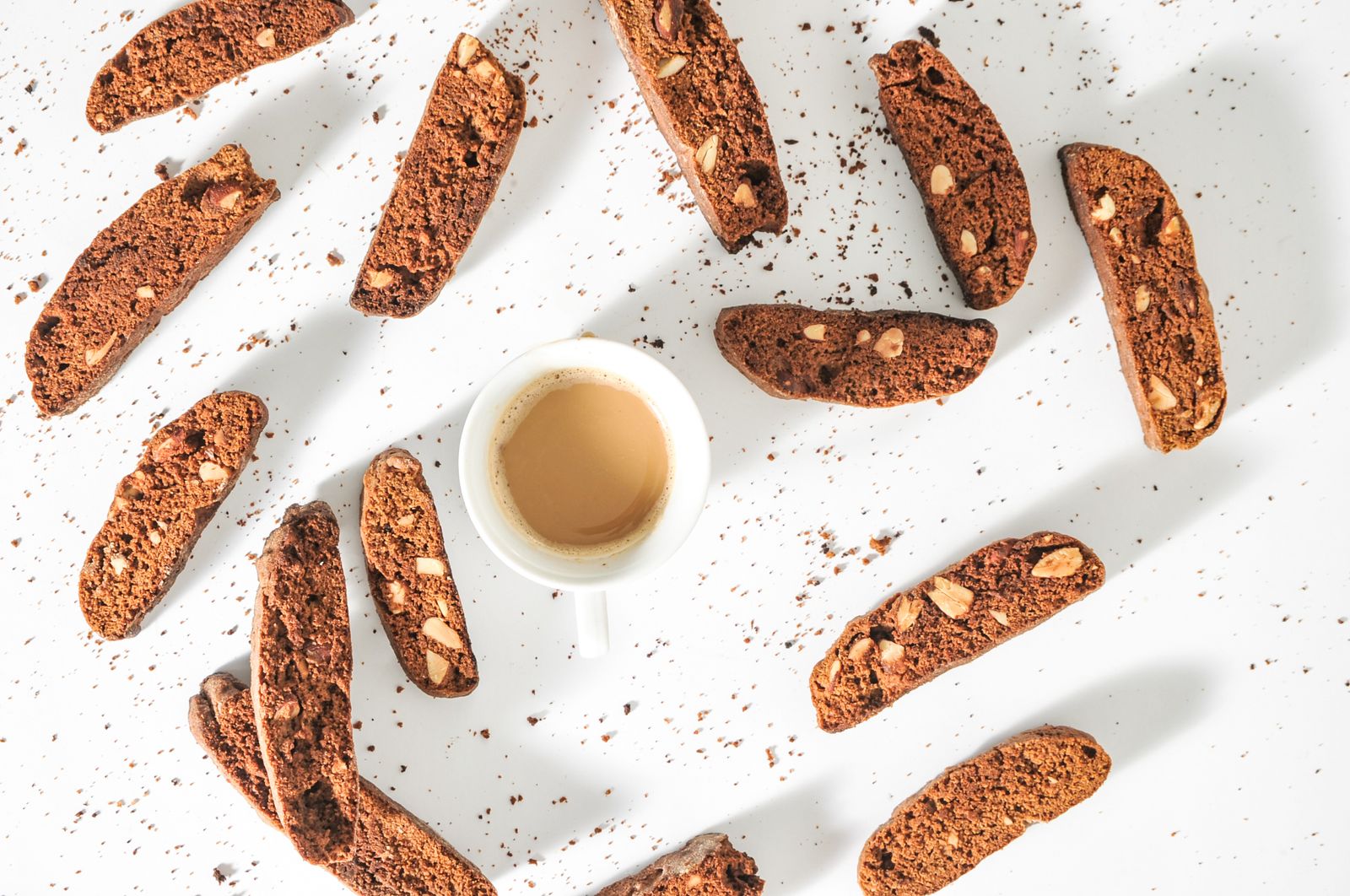 Biscotti: double chocolate biscotti around a cup of coffee