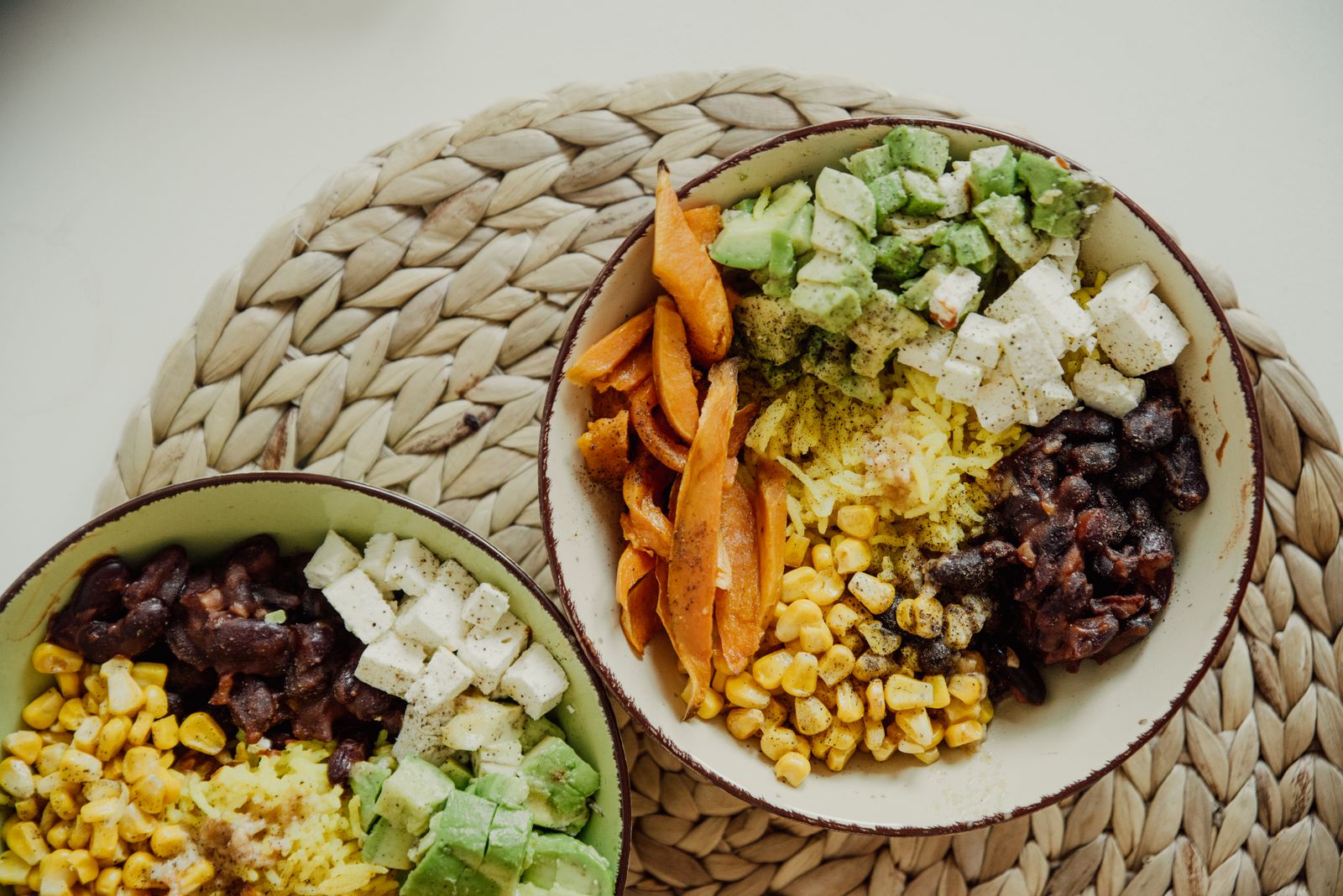 Bowls of black beans, corn and avocado