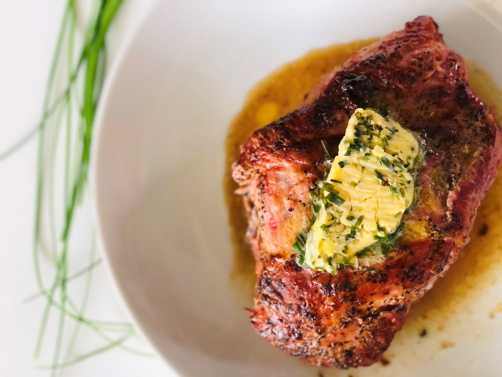 Cowboy butter melting on a grilled steak