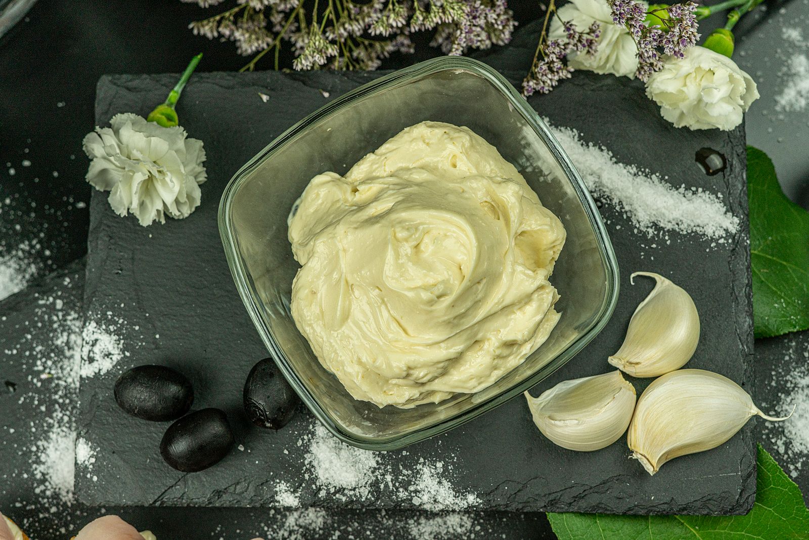 Creamy homemade garlic aioli in a glass bowl