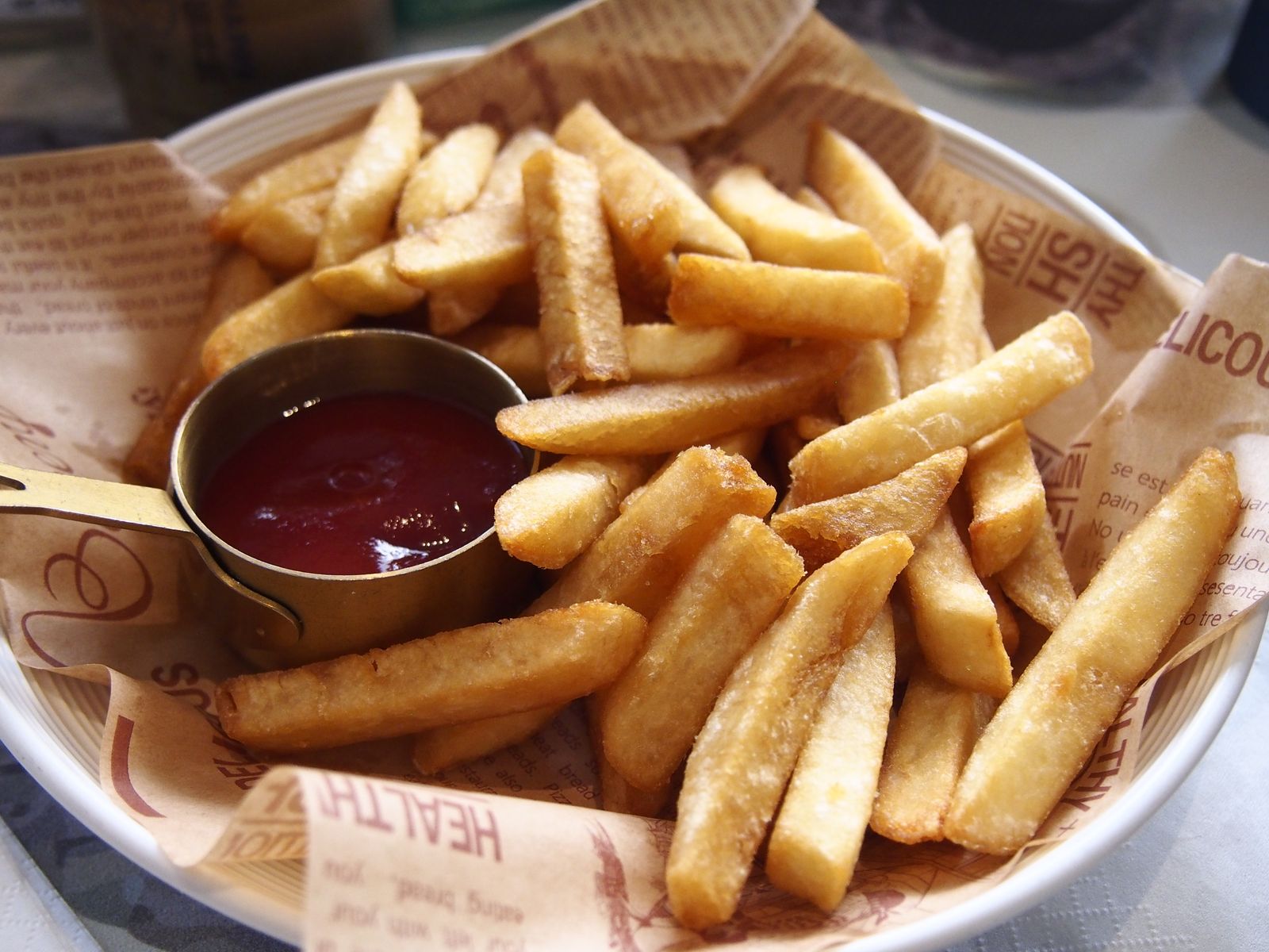 Crispy fries with a bowl of dipping sauce