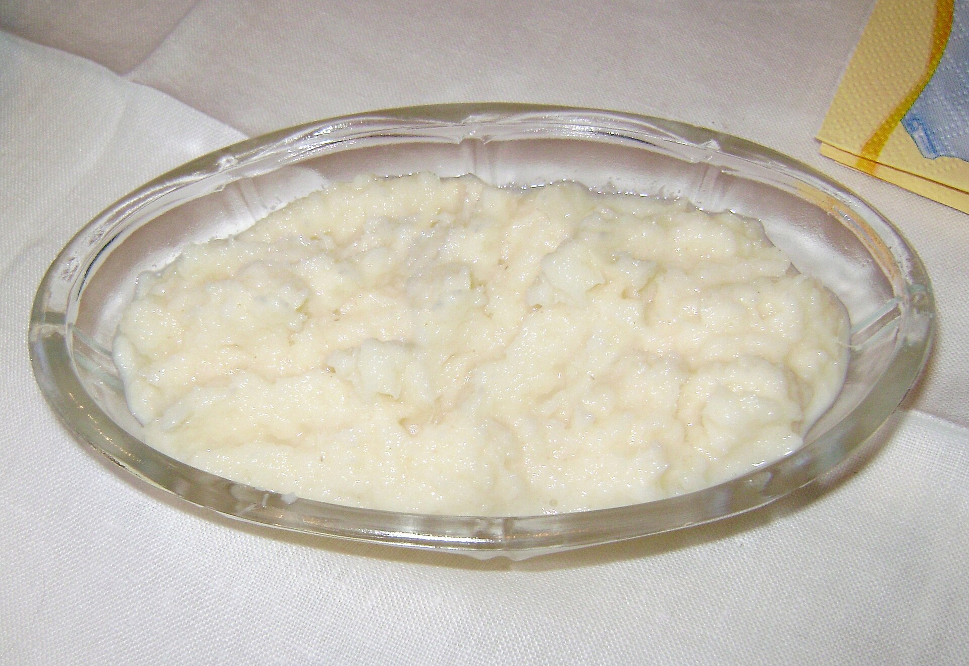 Creamy white horseradish sauce in a glass dish