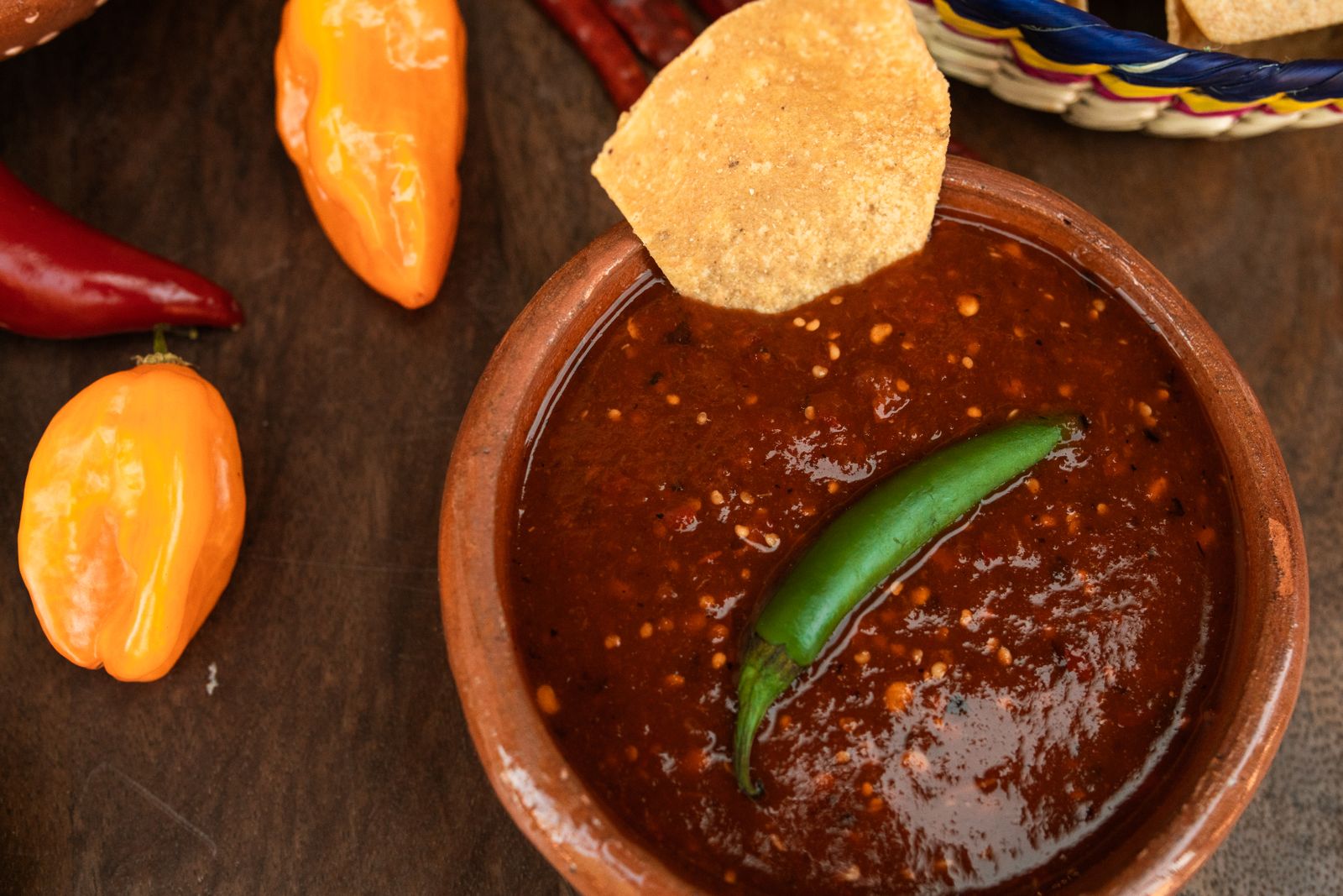 Homemade restaurant style red salsa in a clay bowl