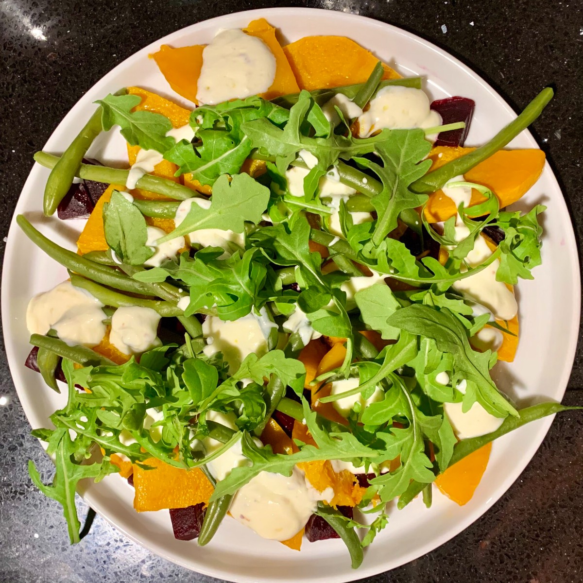 Arugula salad with roasted squash, beets and green beans