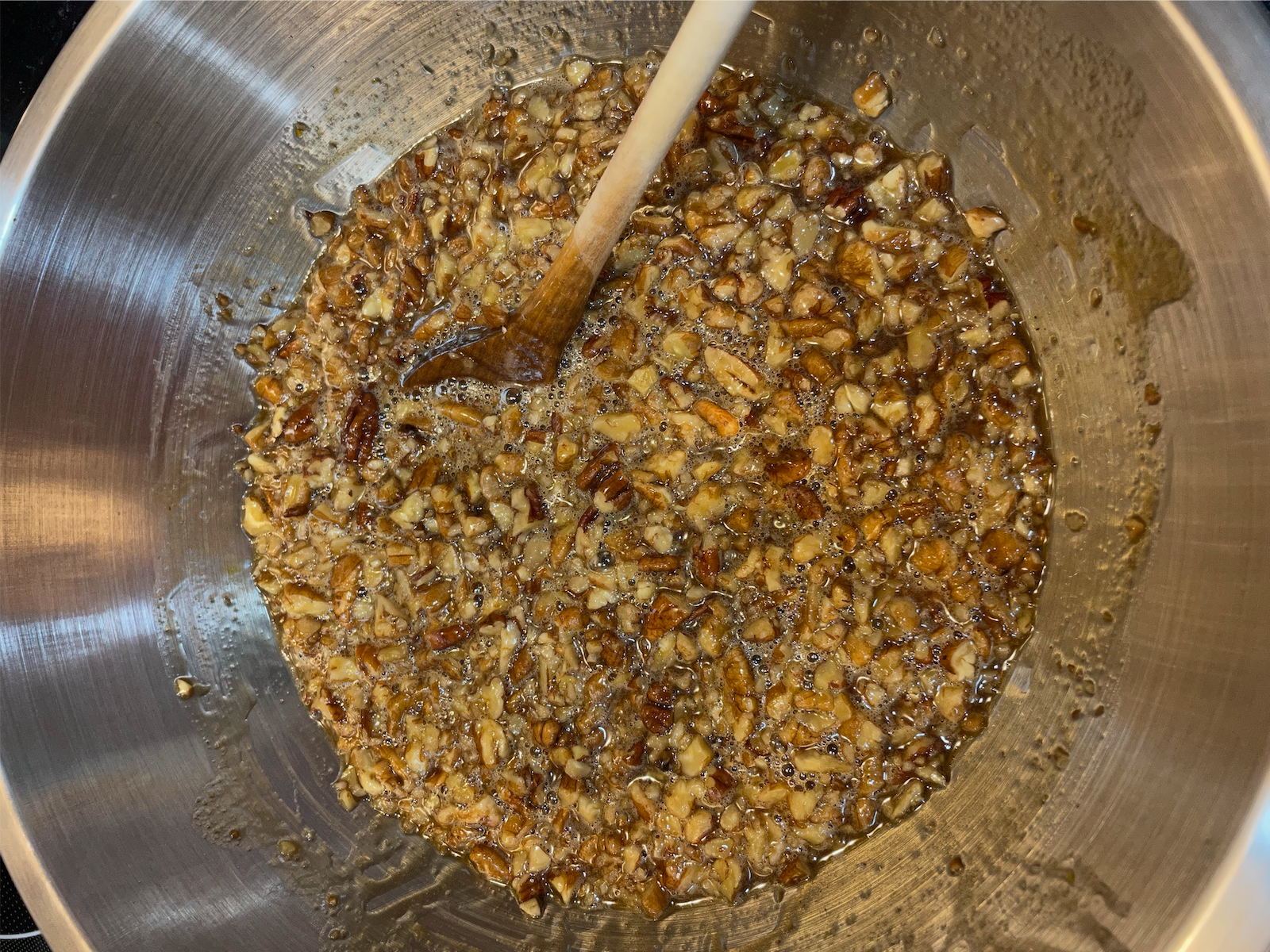 Stirring pecan pie filling in a bowl