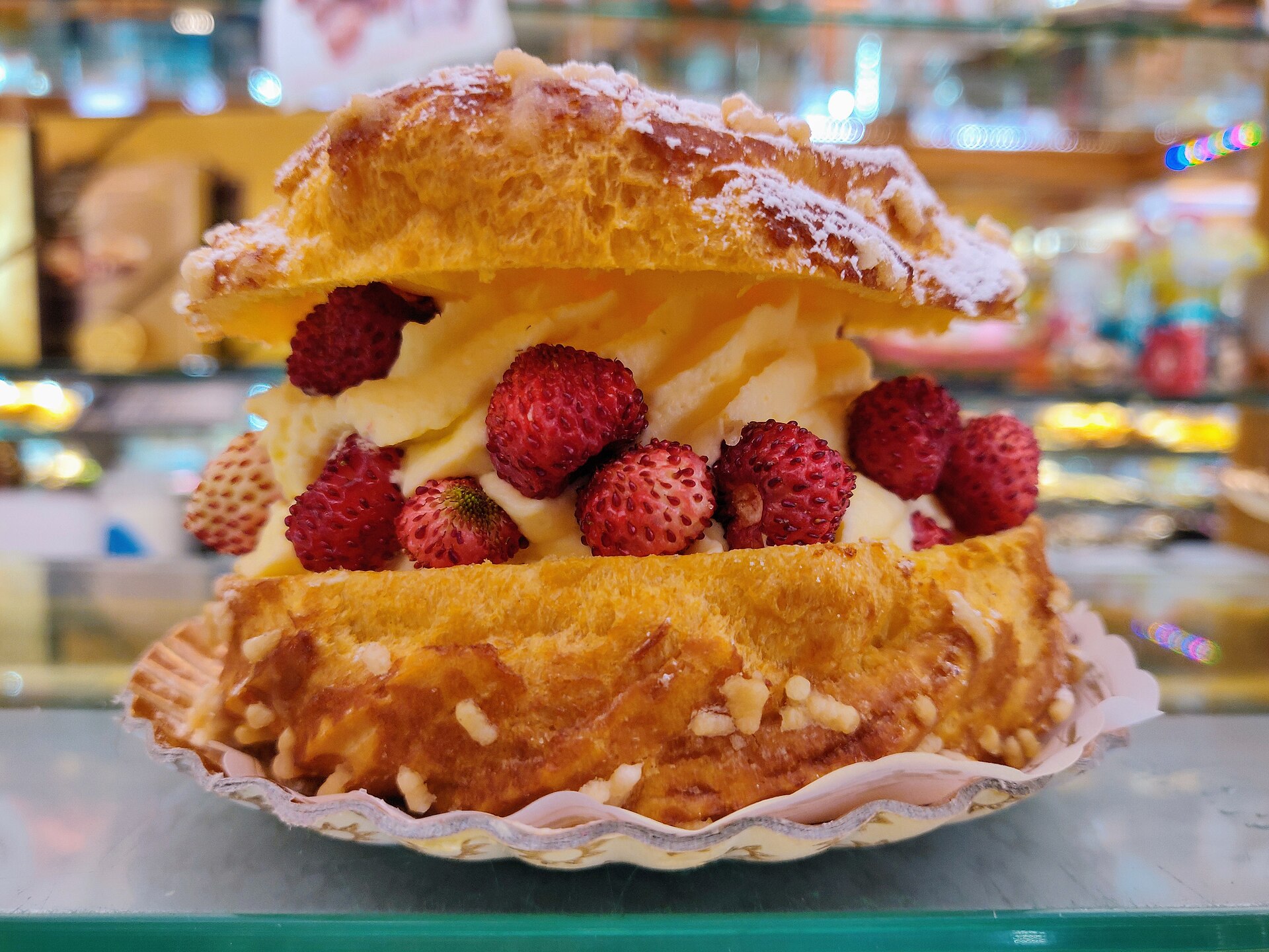 A choux ring filled with cream and wild strawberries