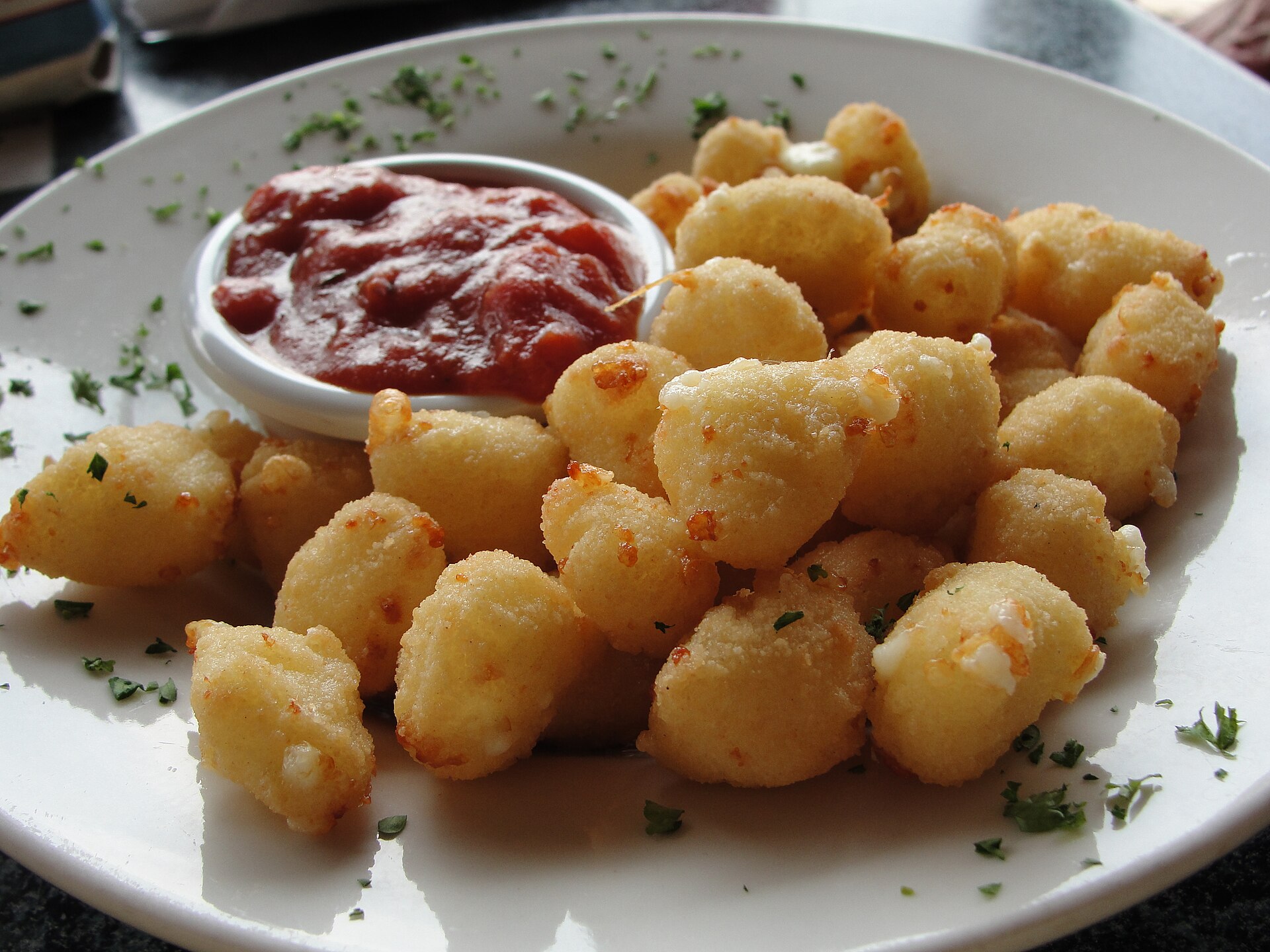 State fair foods favorite: fried cheese curds with a cup of dipping sauce