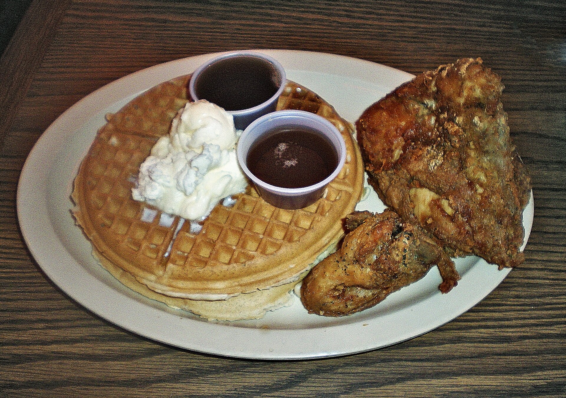 Fried chicken and a golden waffle with syrup