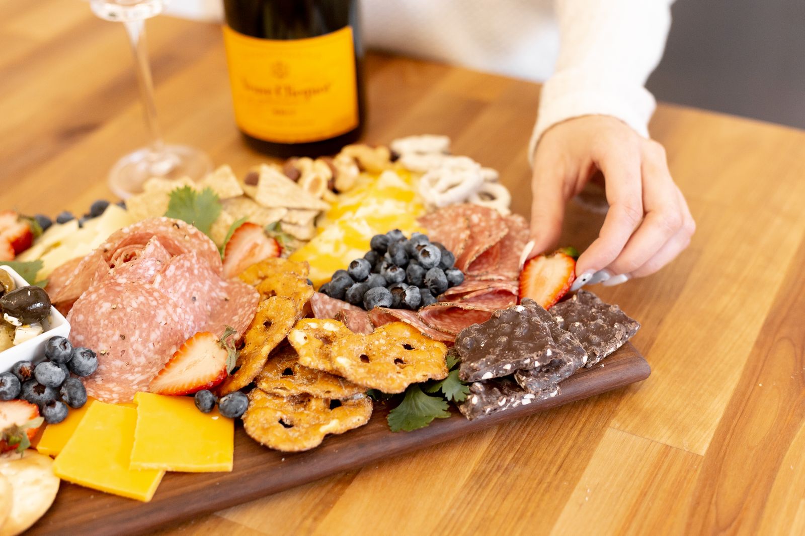 A sweet and salty holiday snack board with crackers
