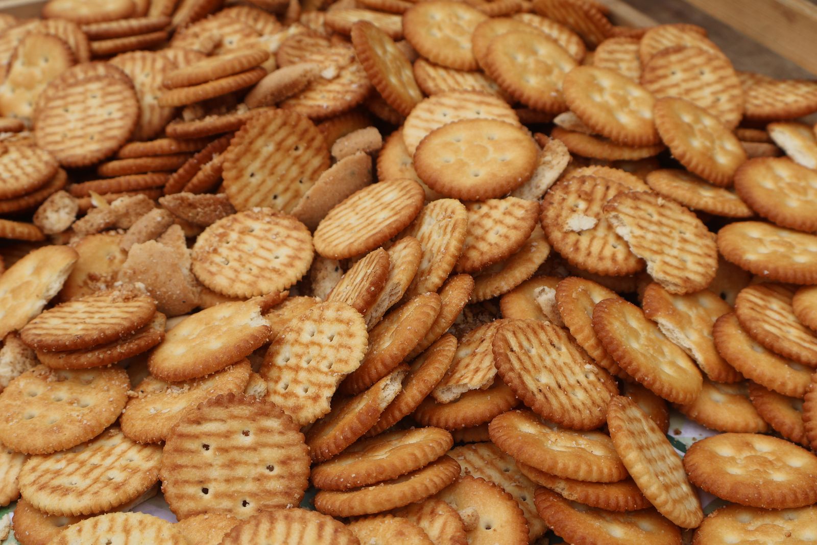 A pile of round buttery crackers ready for dipping