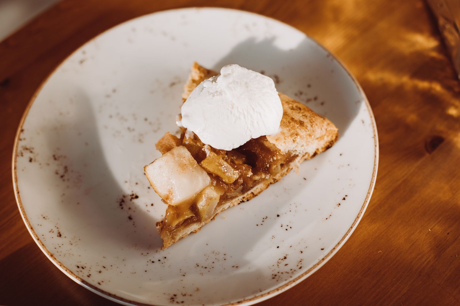 A slice of pie with whipped cream, like vintage mock apple pie