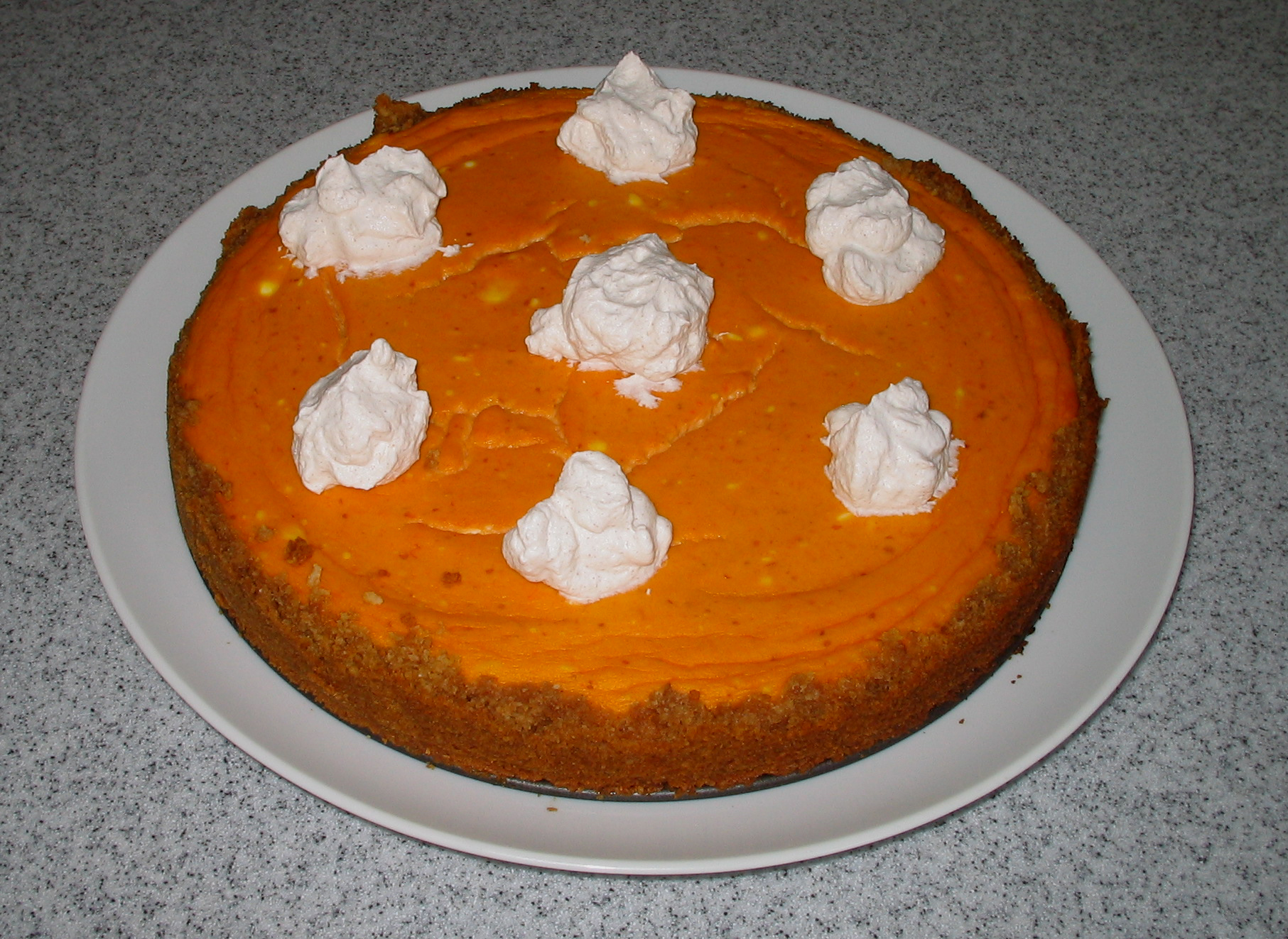 No-bake pumpkin cheesecake pie topped with whipped cream