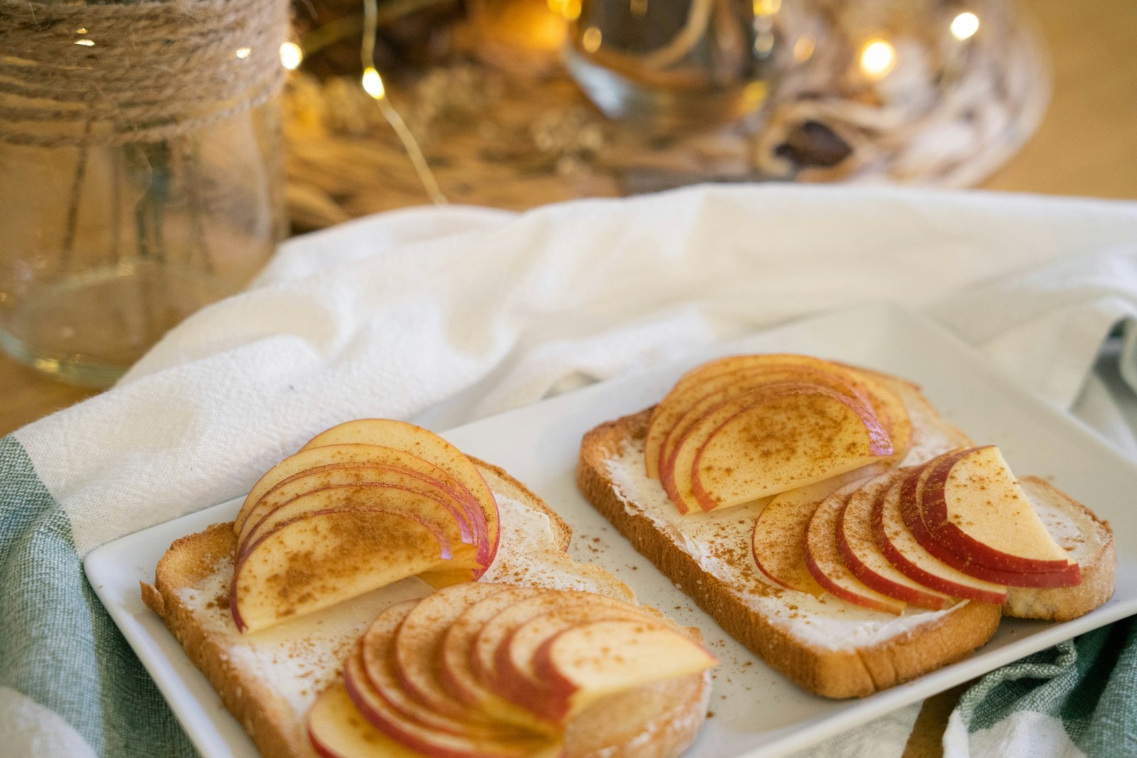 Toasted bread topped with thin apple slices
