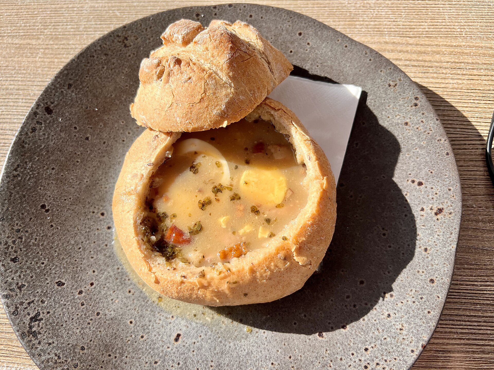 Hot soup served in a small bread bowl