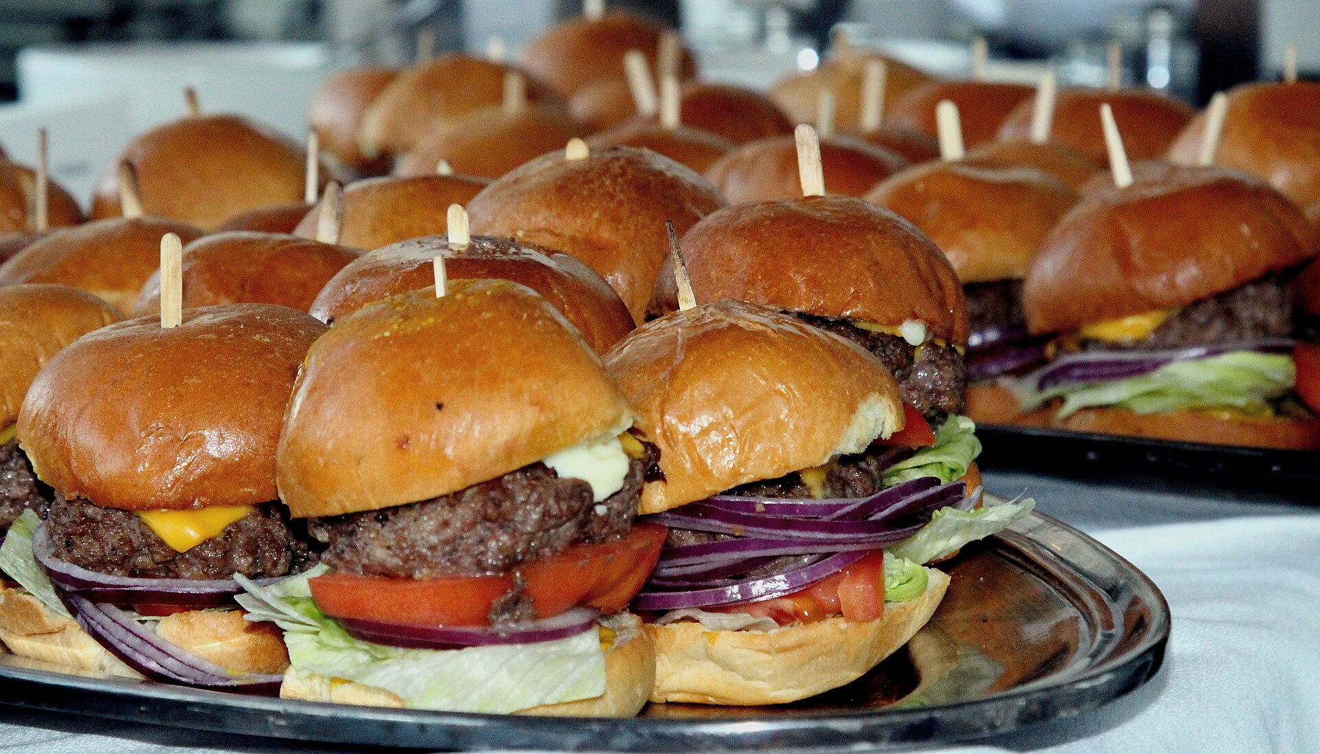 A party tray of mini sandwich sliders