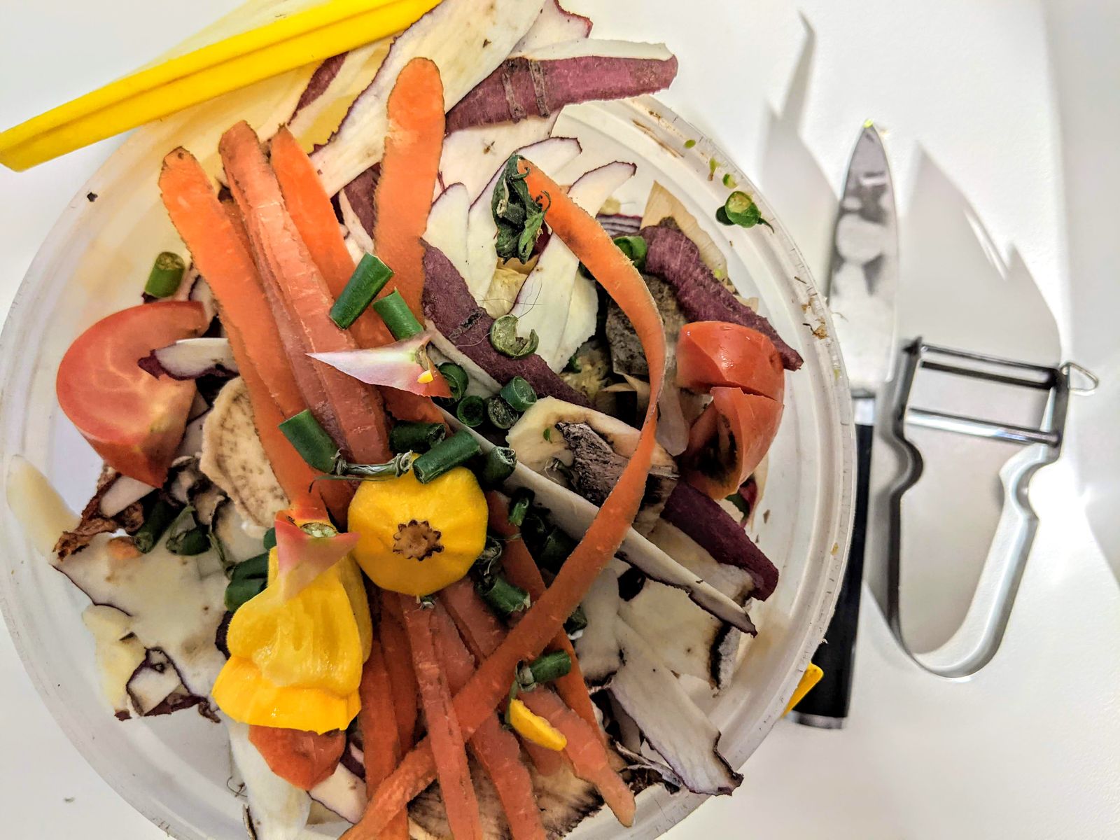 Vegetable peels and ends saved as kitchen scraps for broth