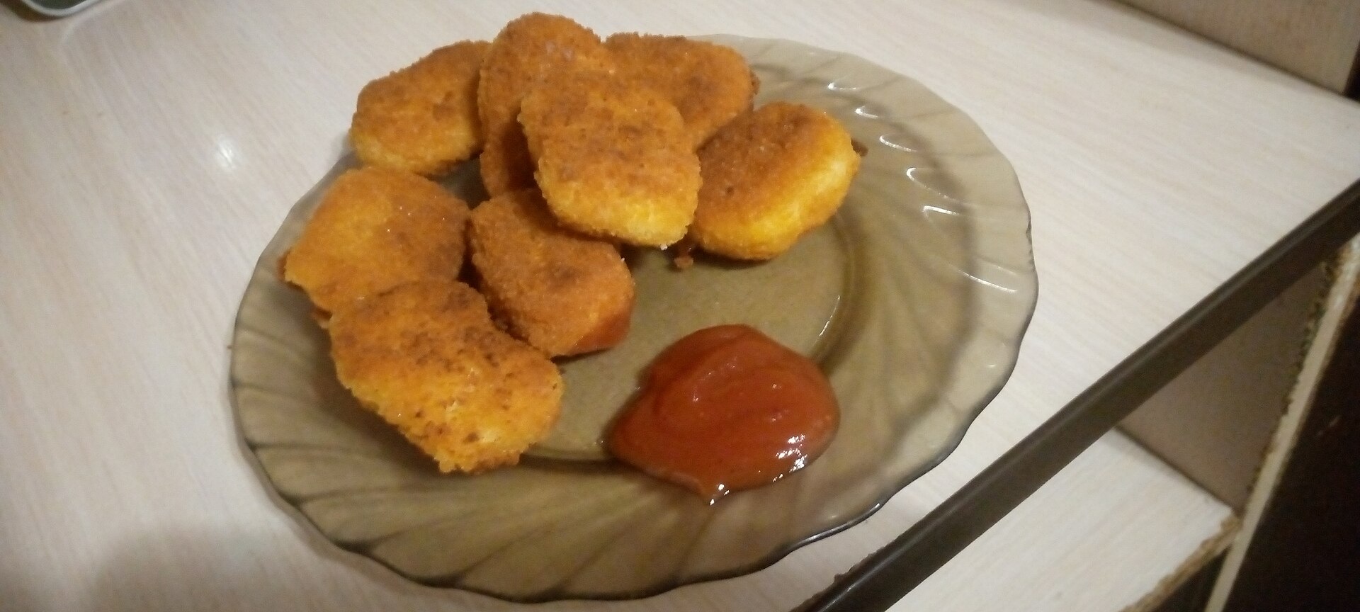 Golden air fryer chicken nuggets with dipping sauce