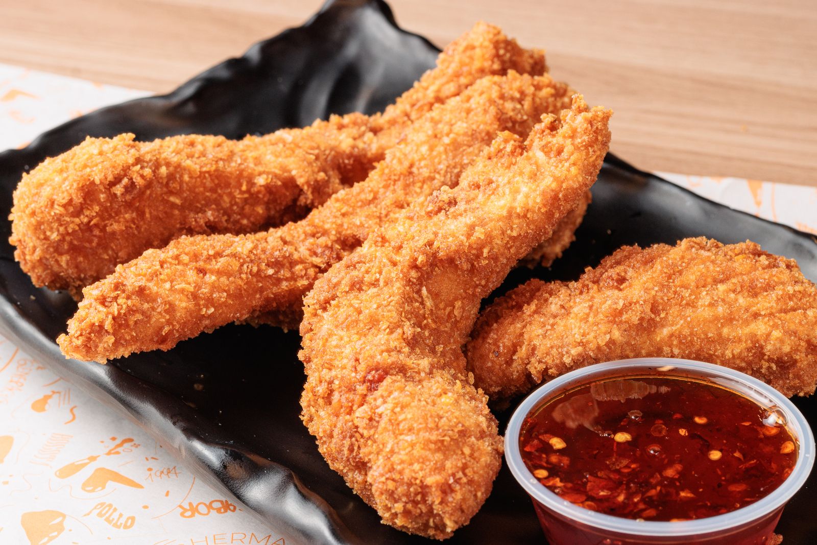 Crispy buttermilk fried tenders with a spicy dip