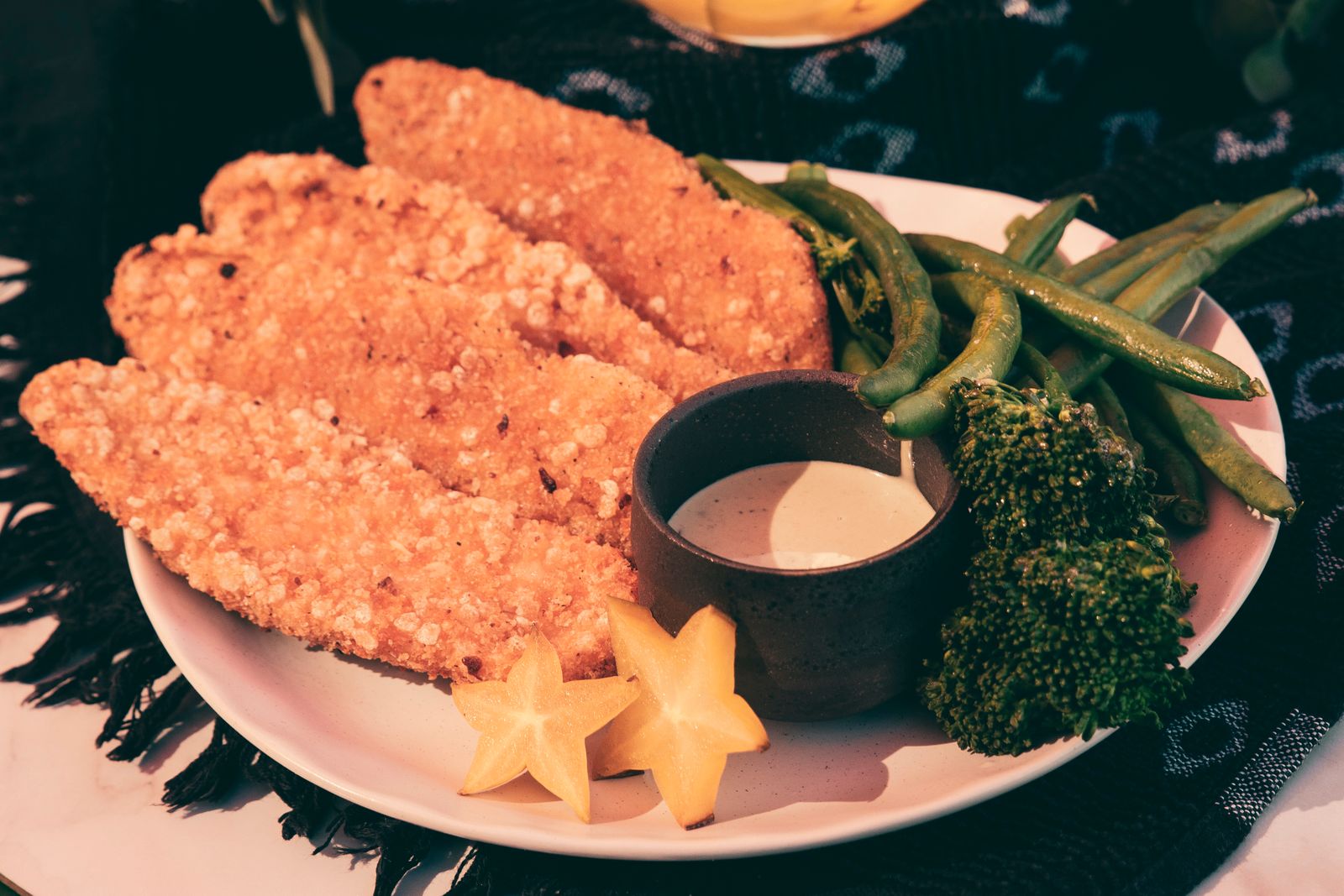 Homemade chicken nuggets and crunchy tenders with a creamy dip