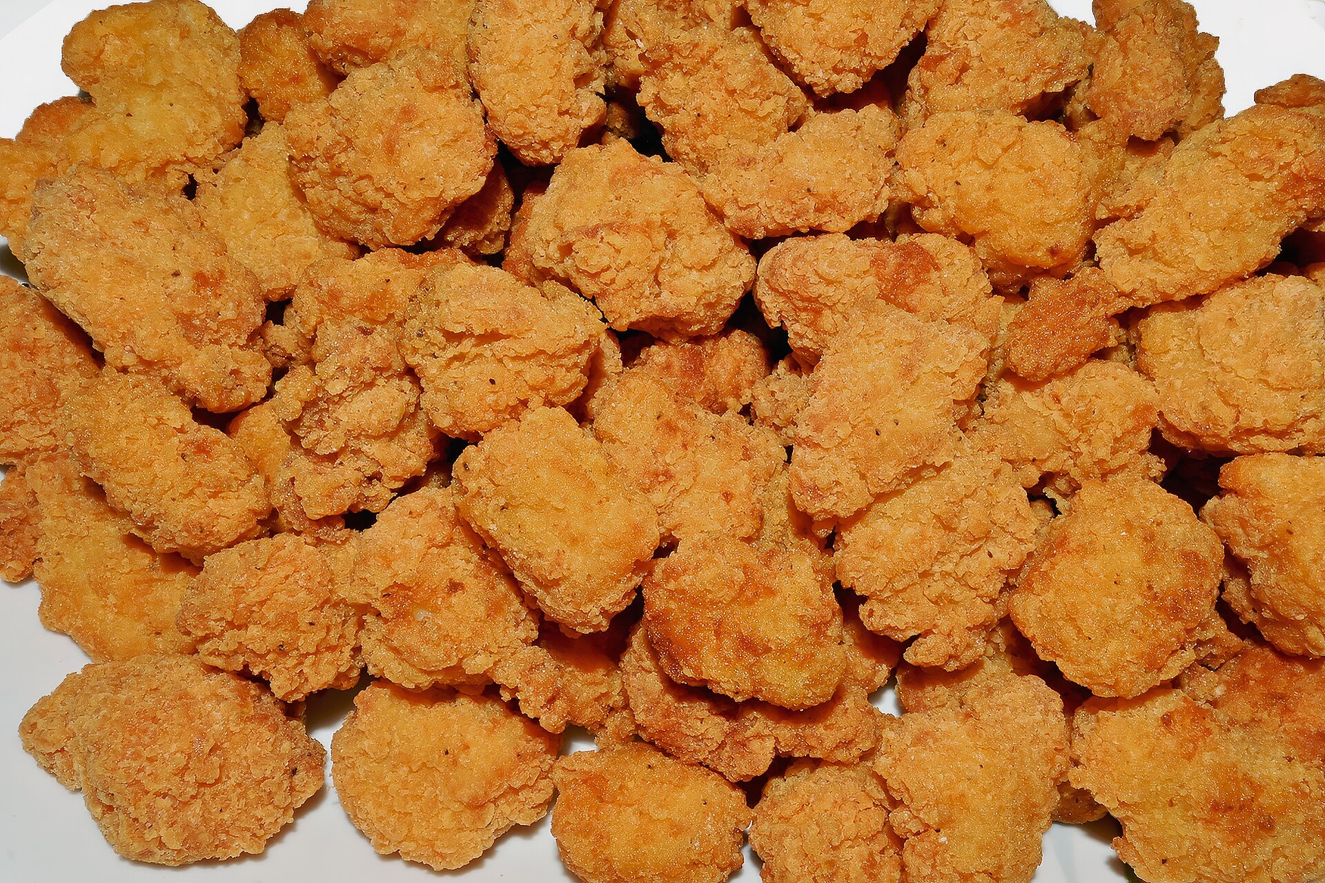 Homemade chicken nuggets in a big crispy batch
