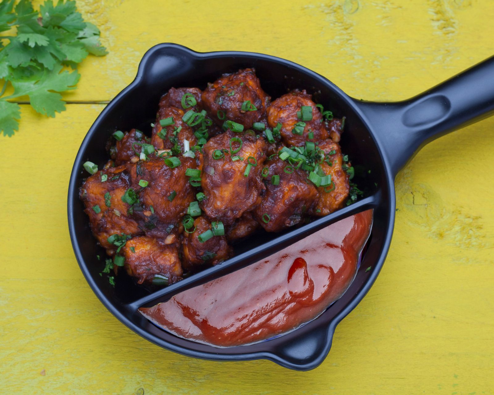 Sticky glazed bites in a cast iron skillet