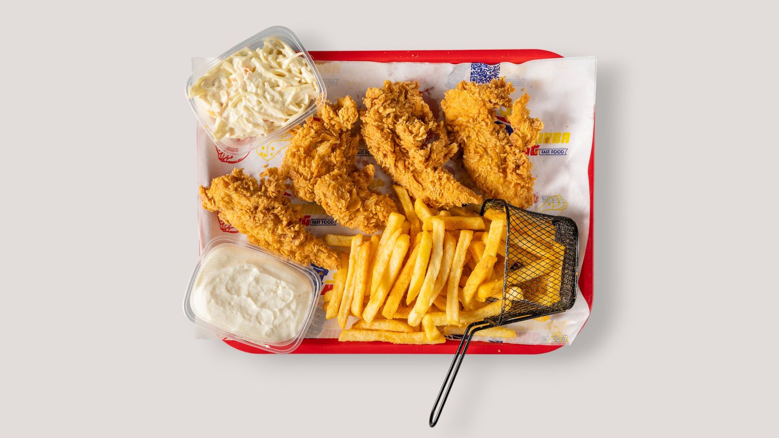 Crispy tenders with fries and coleslaw on a tray