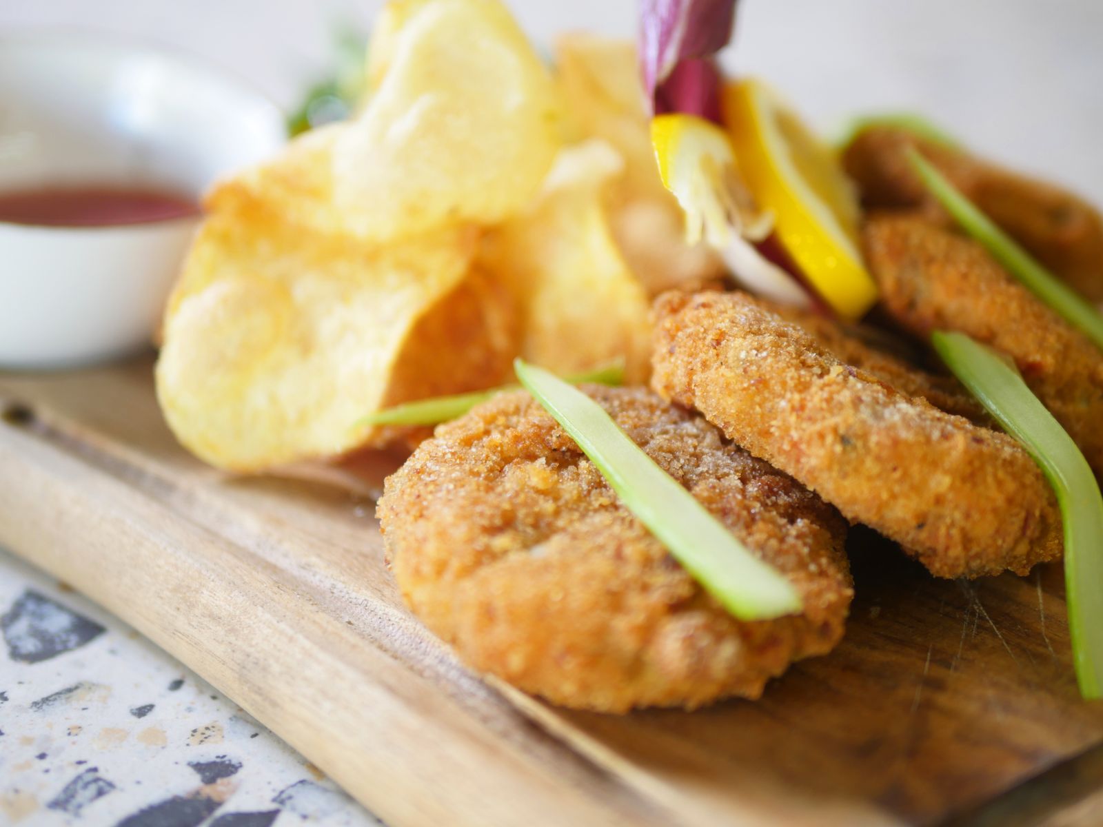 Fried fish cakes on a wooden board