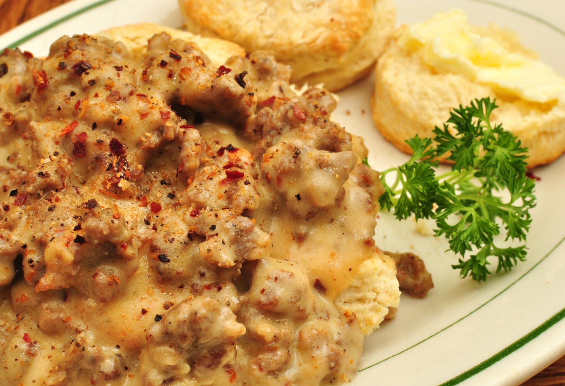 Southern breakfast: buttermilk biscuits covered in peppery sausage gravy