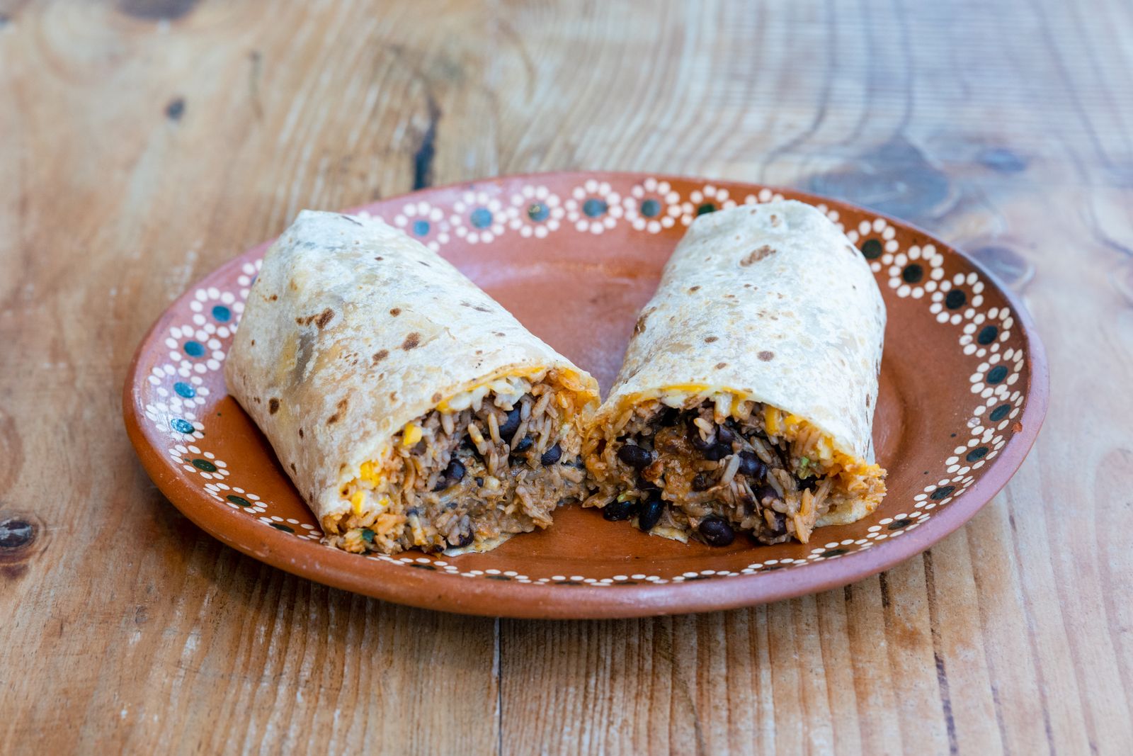 Bean and cheese burritos cut in half