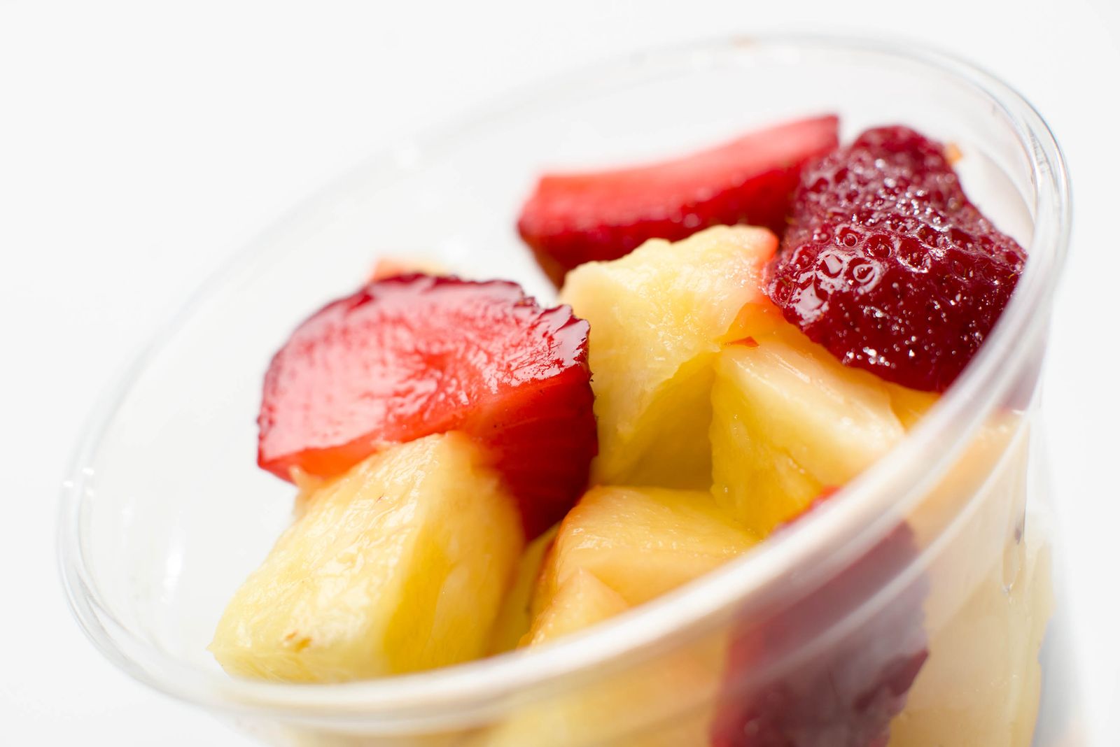 Fresh fruit cup for a school lunch with pineapple and strawberries