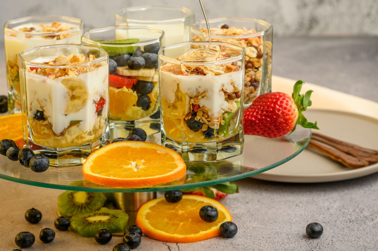 Plain yogurt parfaits with fruit and granola