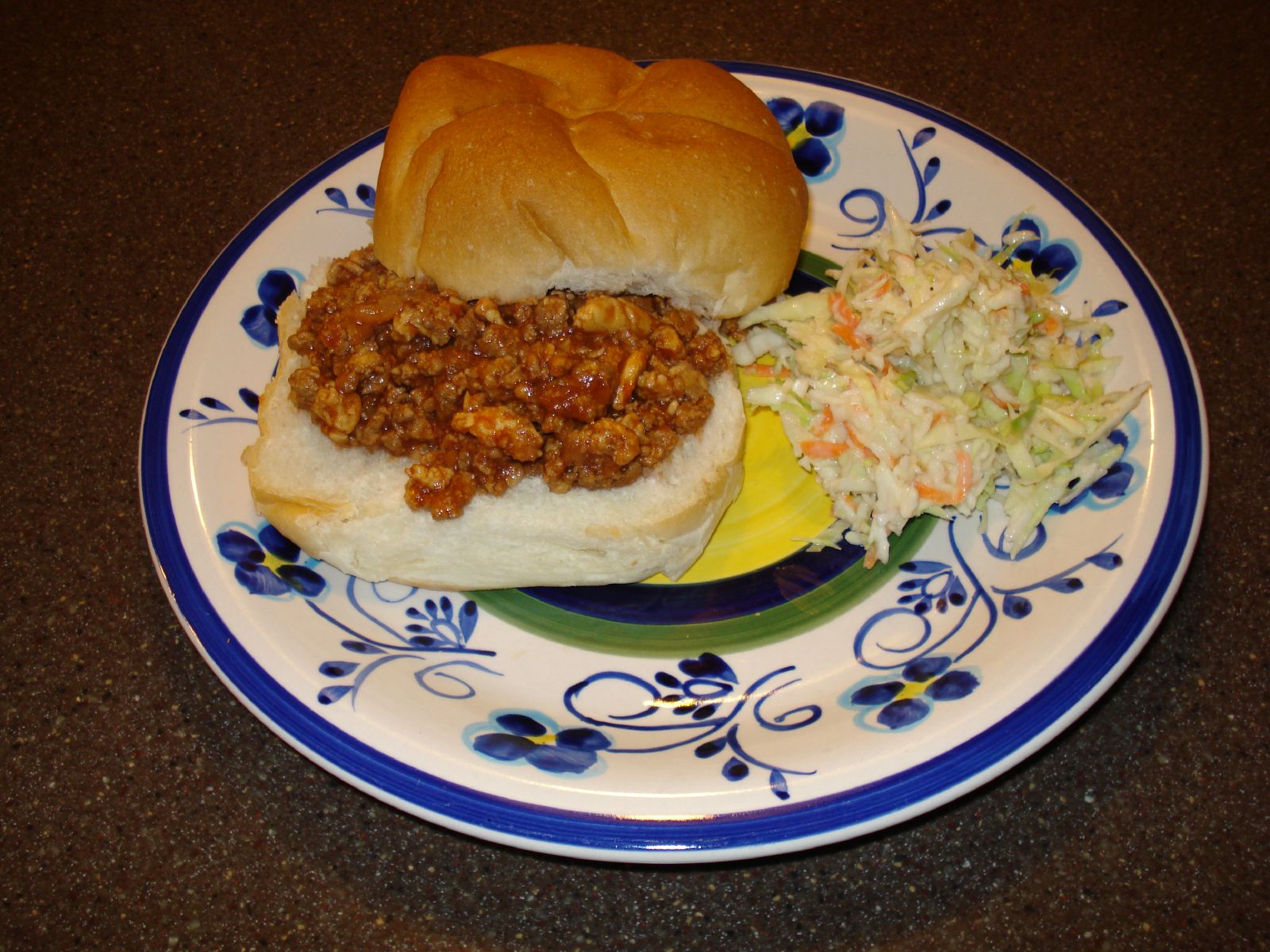 Homemade sloppy joe on a bun with slaw