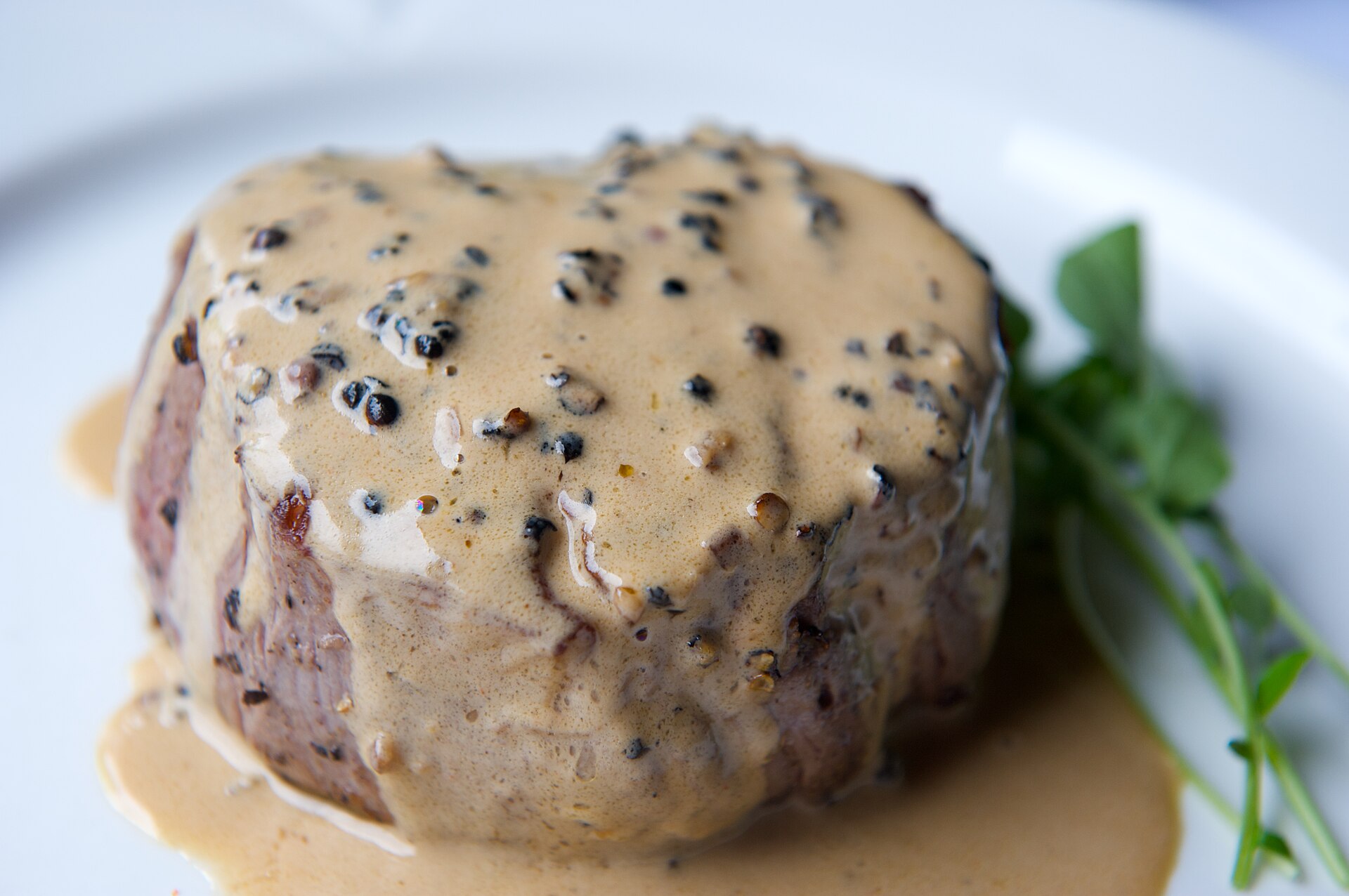 Steak au poivre with a thick pepper crust and creamy peppercorn sauce