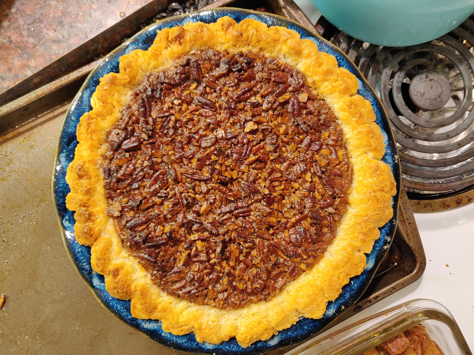 Thanksgiving for two: pecan pie on a blue plate