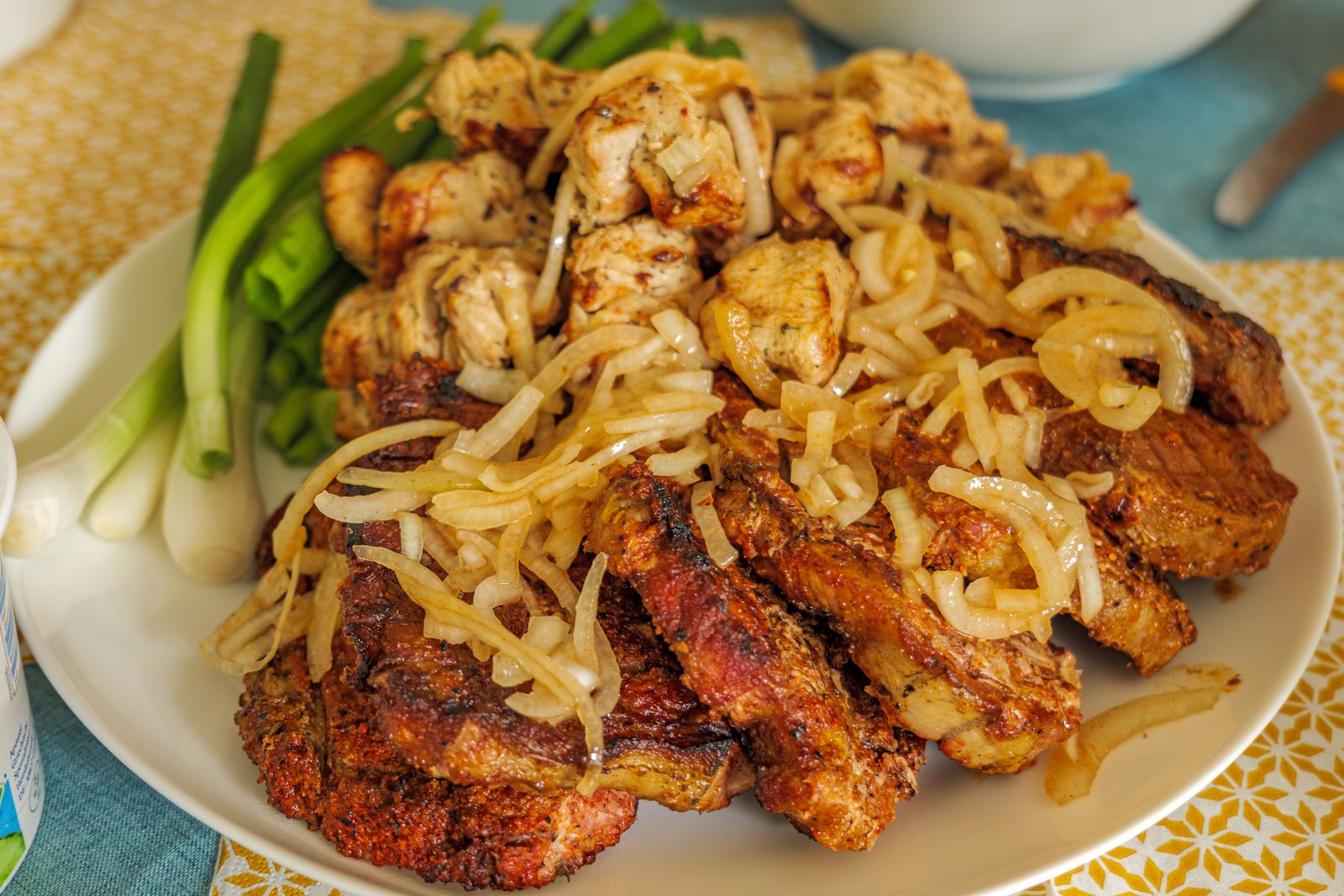Sweet caramelized onions piled on meat