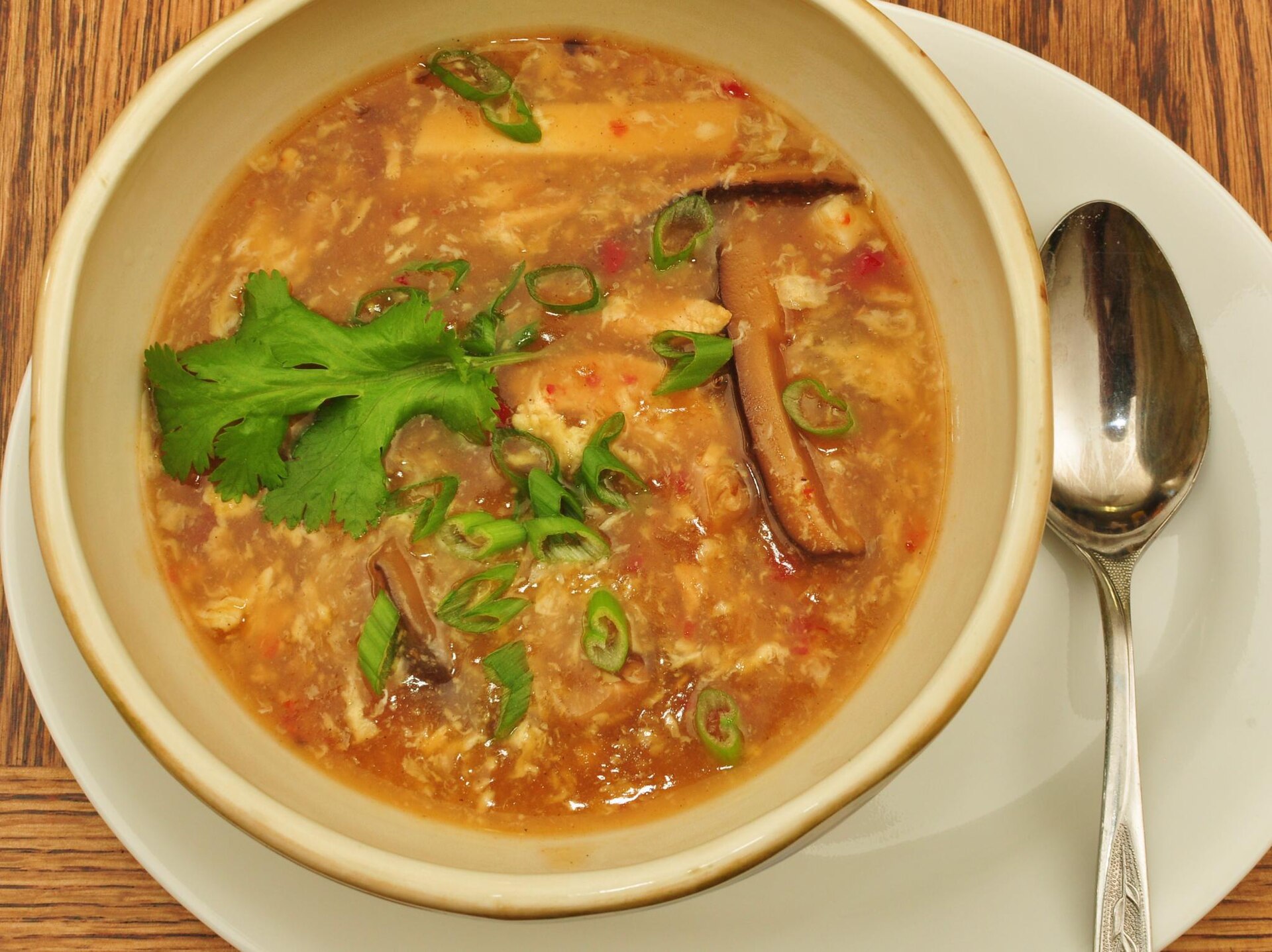 Hot and sour soup with tofu and cilantro