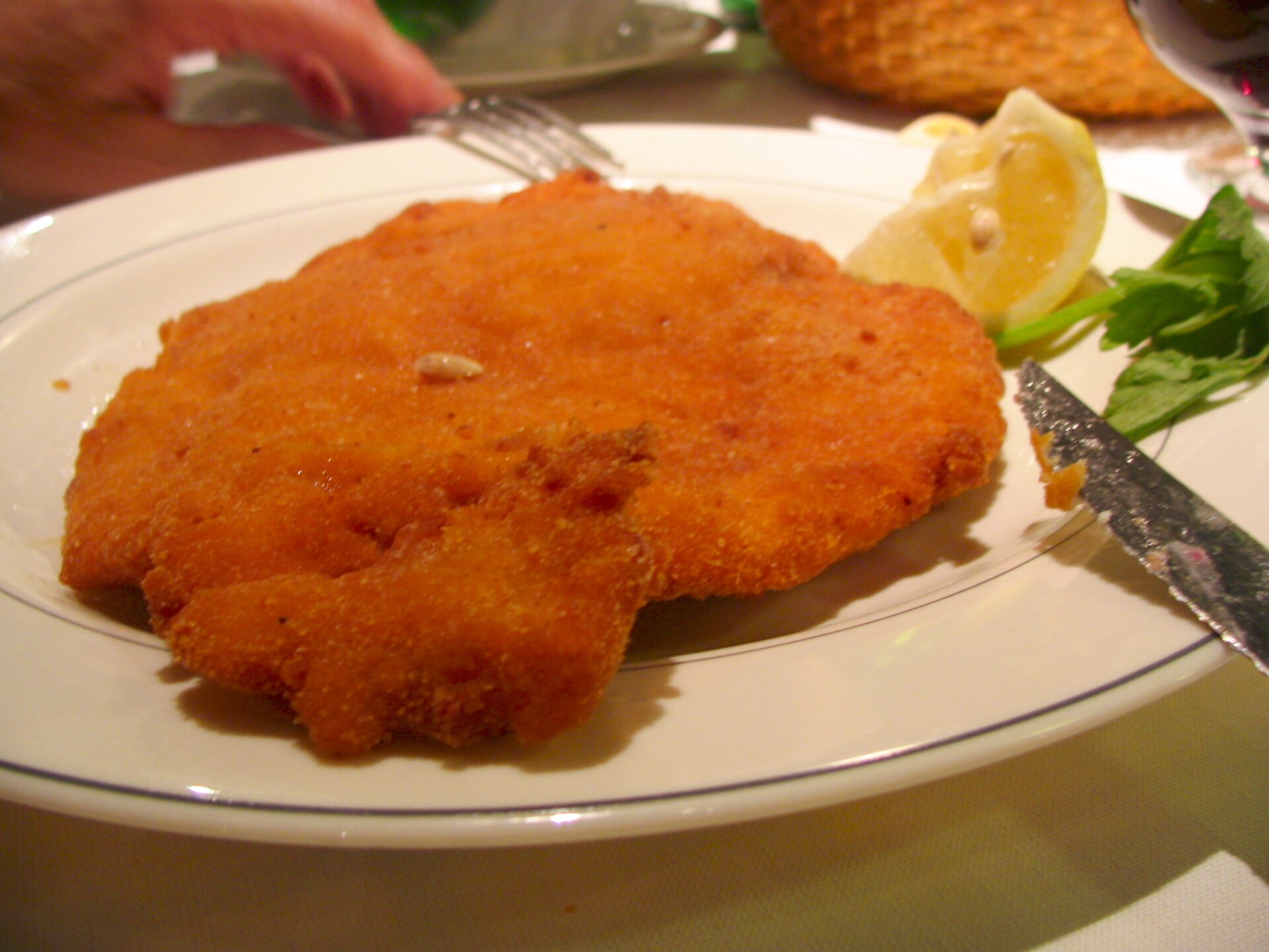 Golden breaded cotoletta alla milanese with lemon