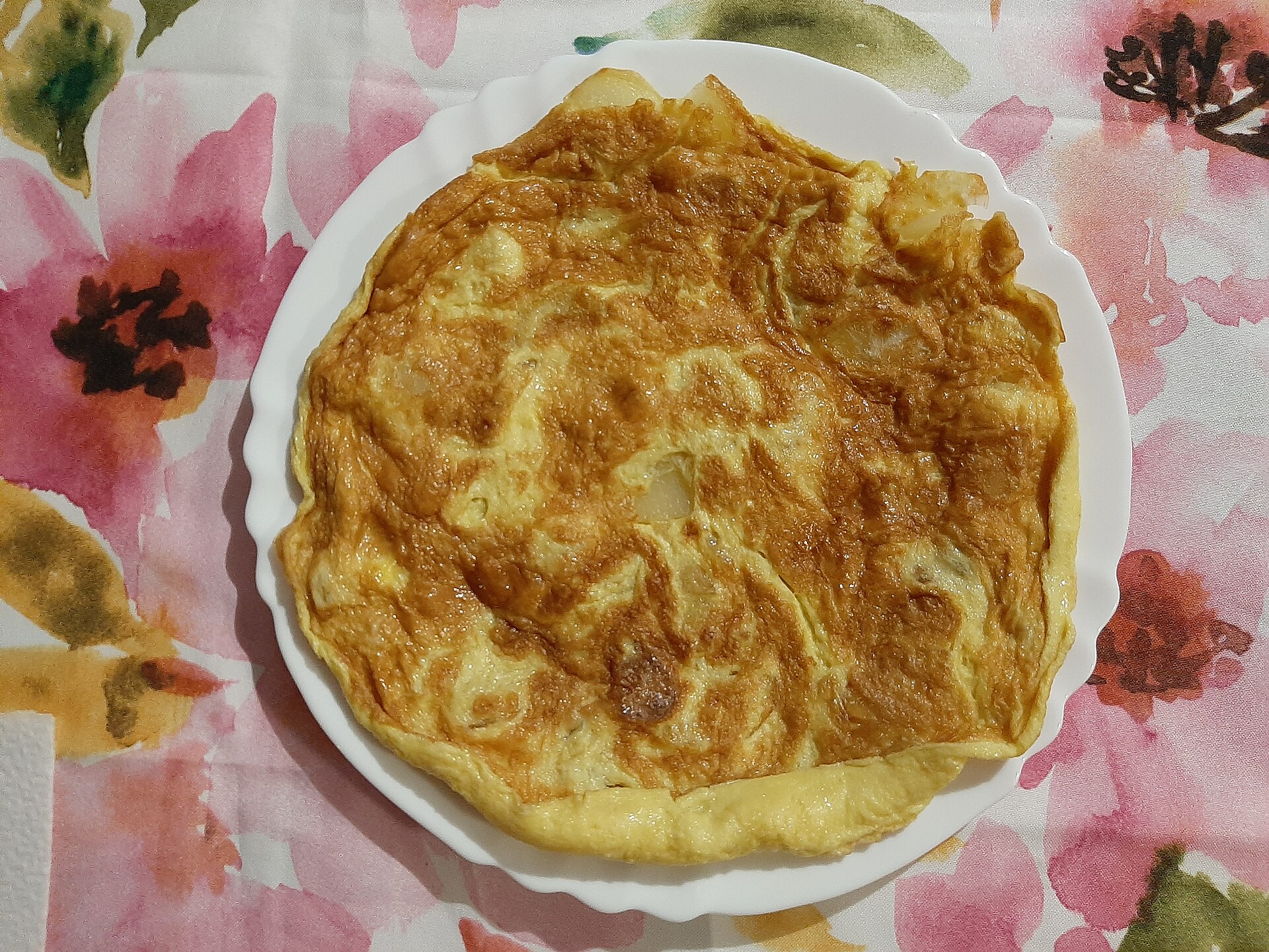 Golden Italian potato frittata on a plate