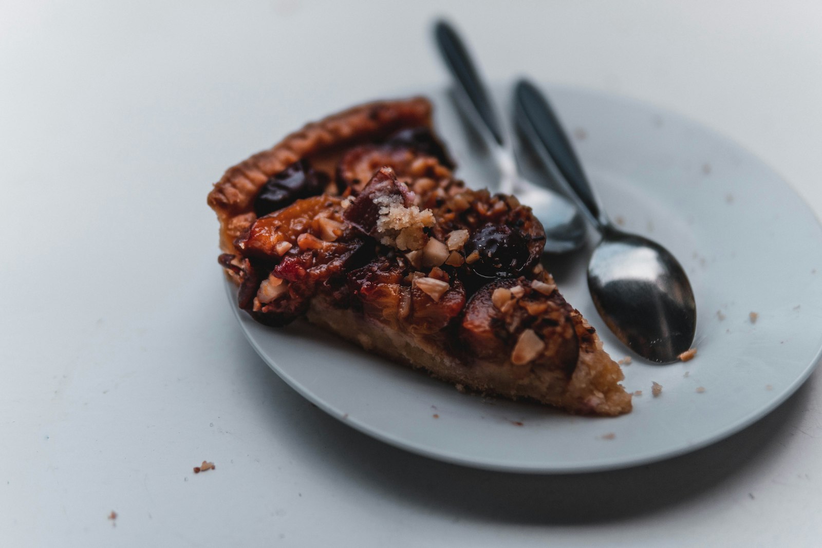 Slice of nut pie with chocolate on a plate